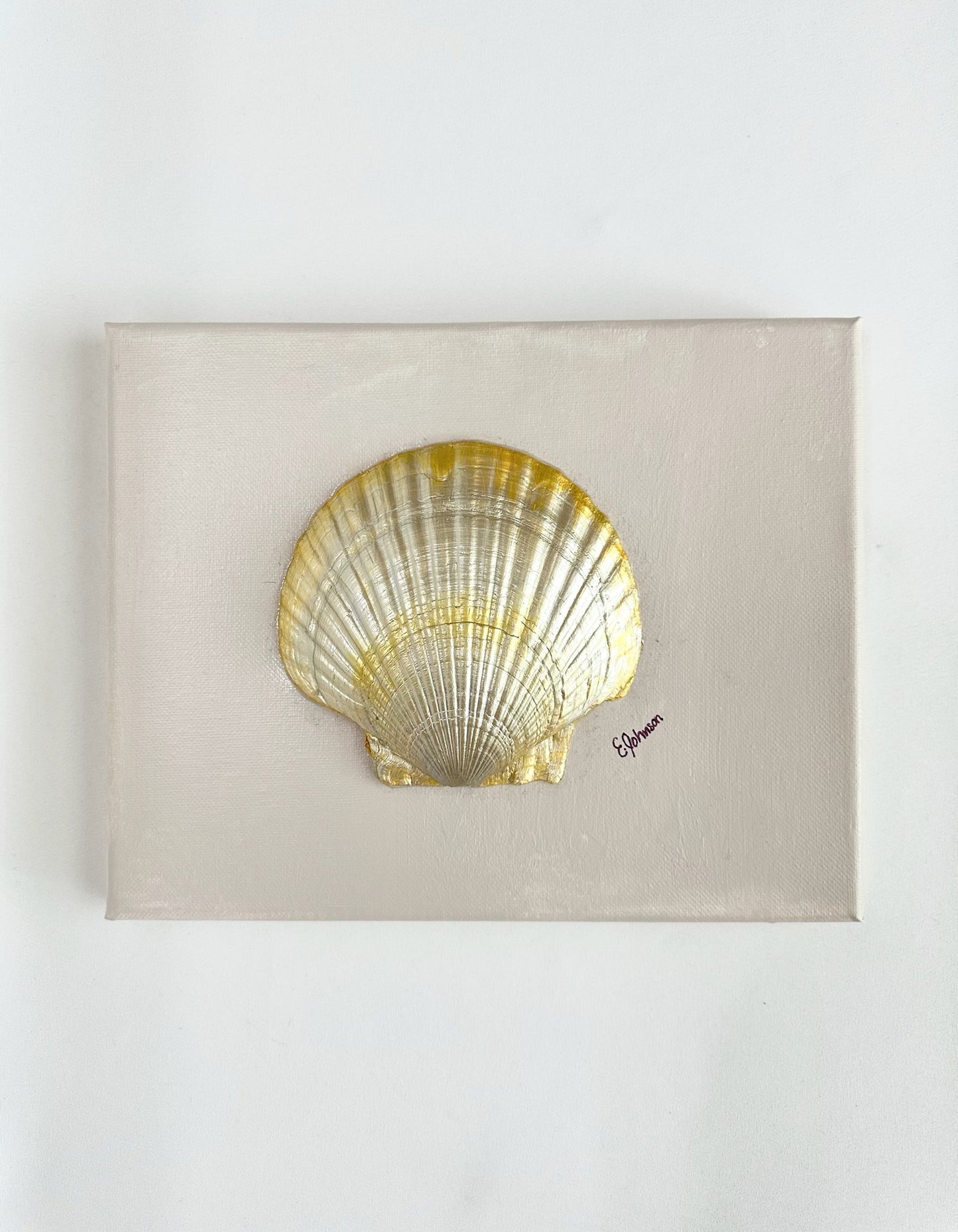 painted canvas with mounted, gilded clamshell. artist signed