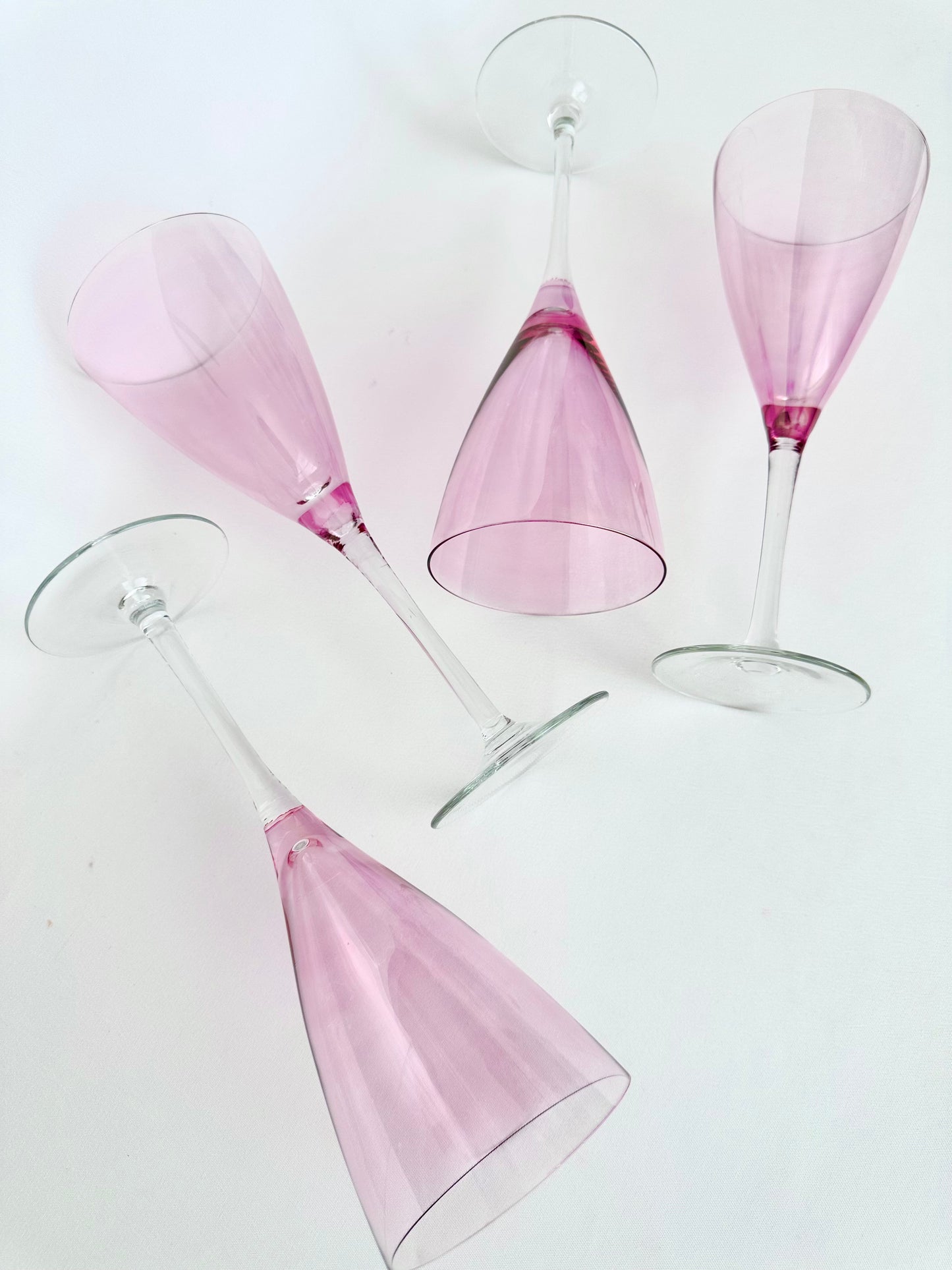 Vintage pink flashed glass tall stemmed champagne flutes set of four.