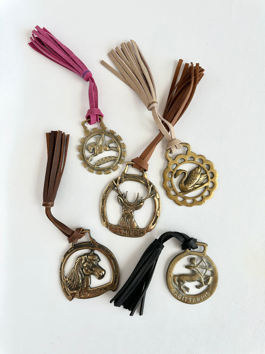 Vintage brass horse medallions paired with leather tassel of five different designs- for purchase individually