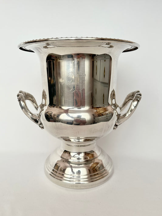 Vintage silverplate large trophy cup or champagne bucket with handles and footed base.