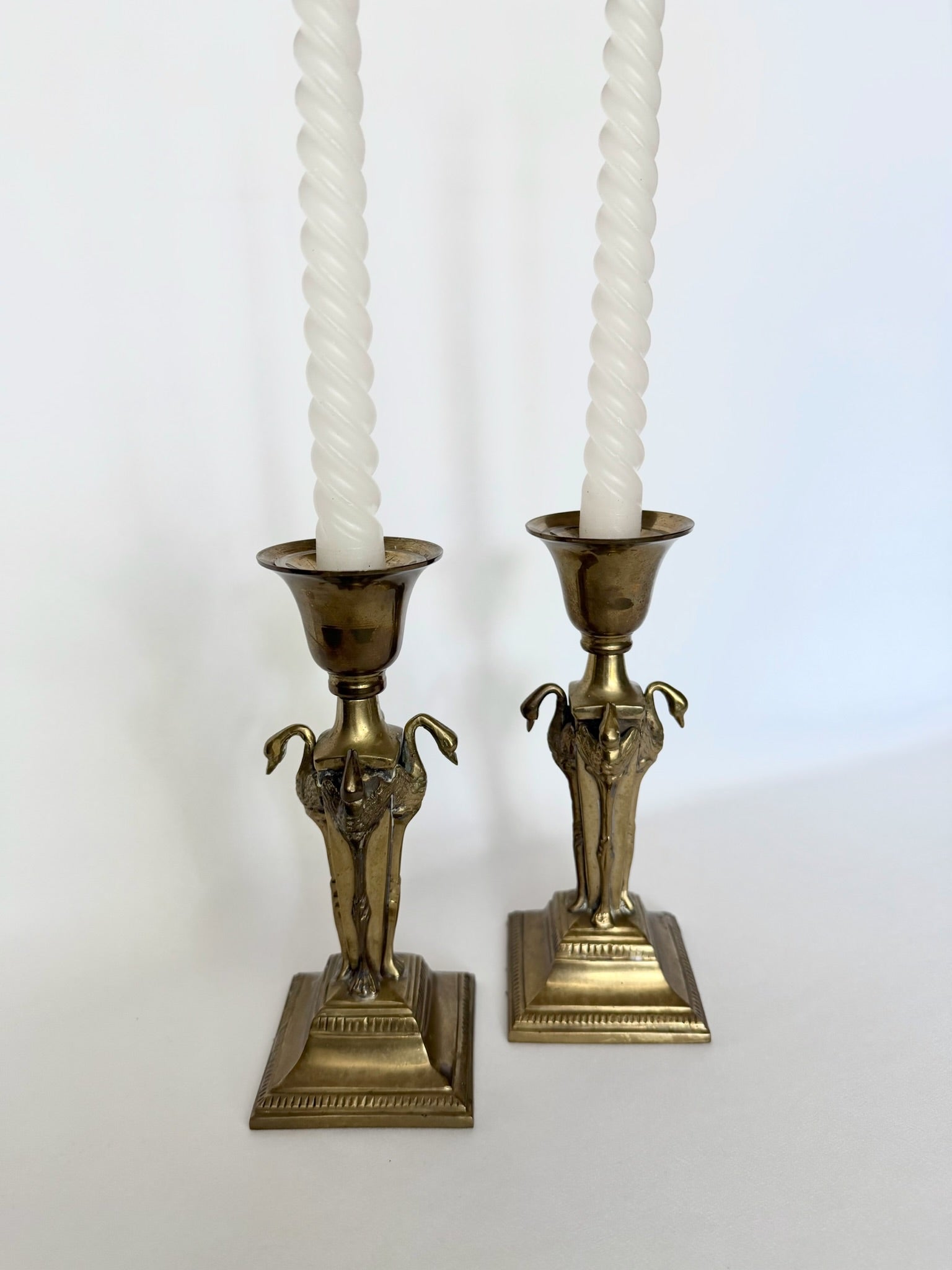 vintage brass candlesticks set of two with sculptural flamingos on four sides