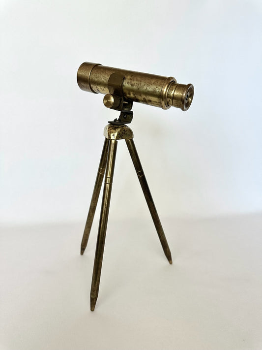 vintage brass table top telescope on tripod stand