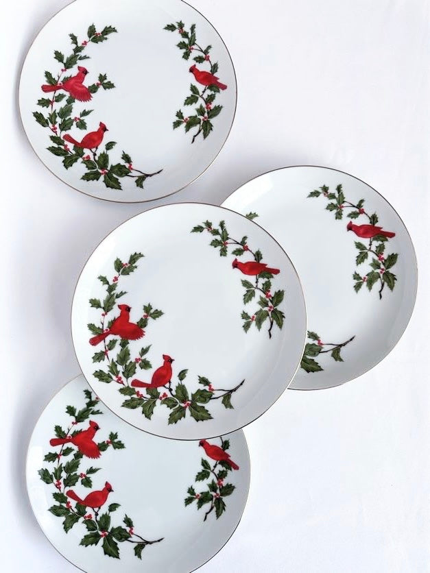 White China salad or snack plates set of four with red cardinals and green holly leaves.