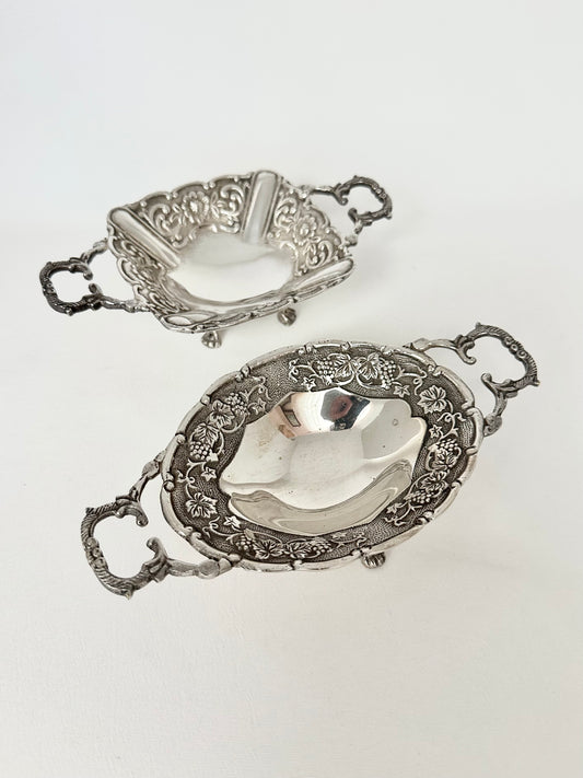 Vintage ornate silverplate small footed dishes set of two.