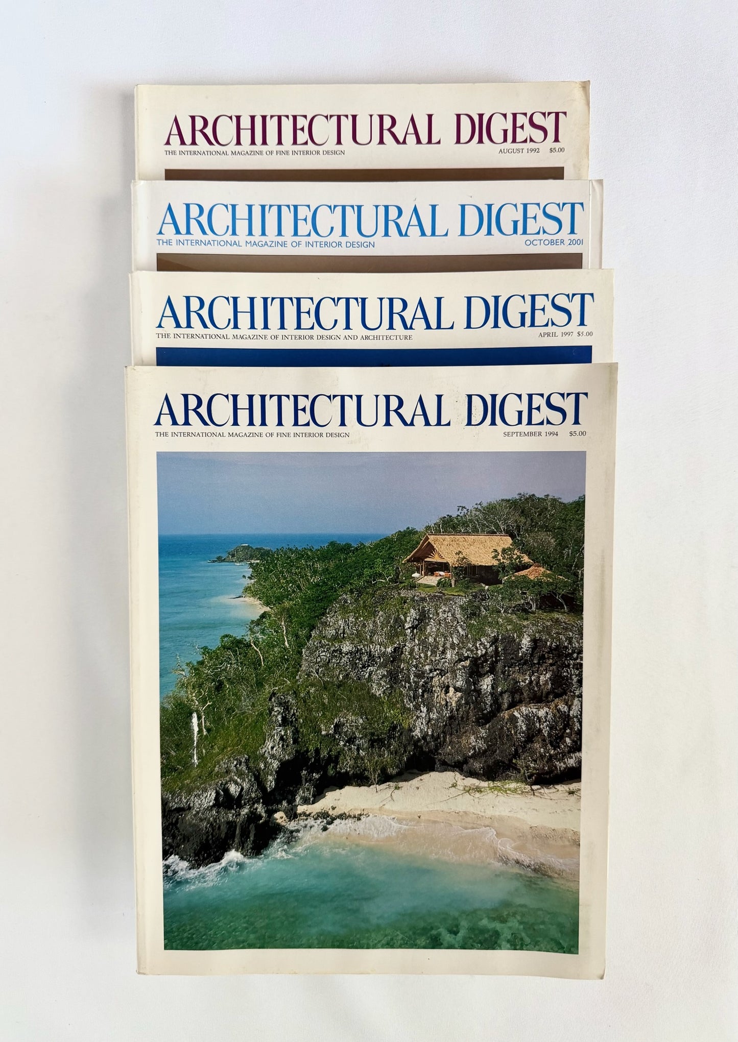 vintage architectural digest magazine stack with coastal inspired covers
