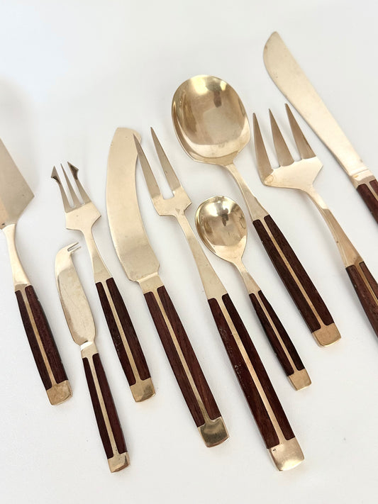 vintage teak and brass serving set of nine including pie server, cheese knife, cheese fork, cake knife, meat fork, condiment spoon, large spoon, large fork, slicing knife 