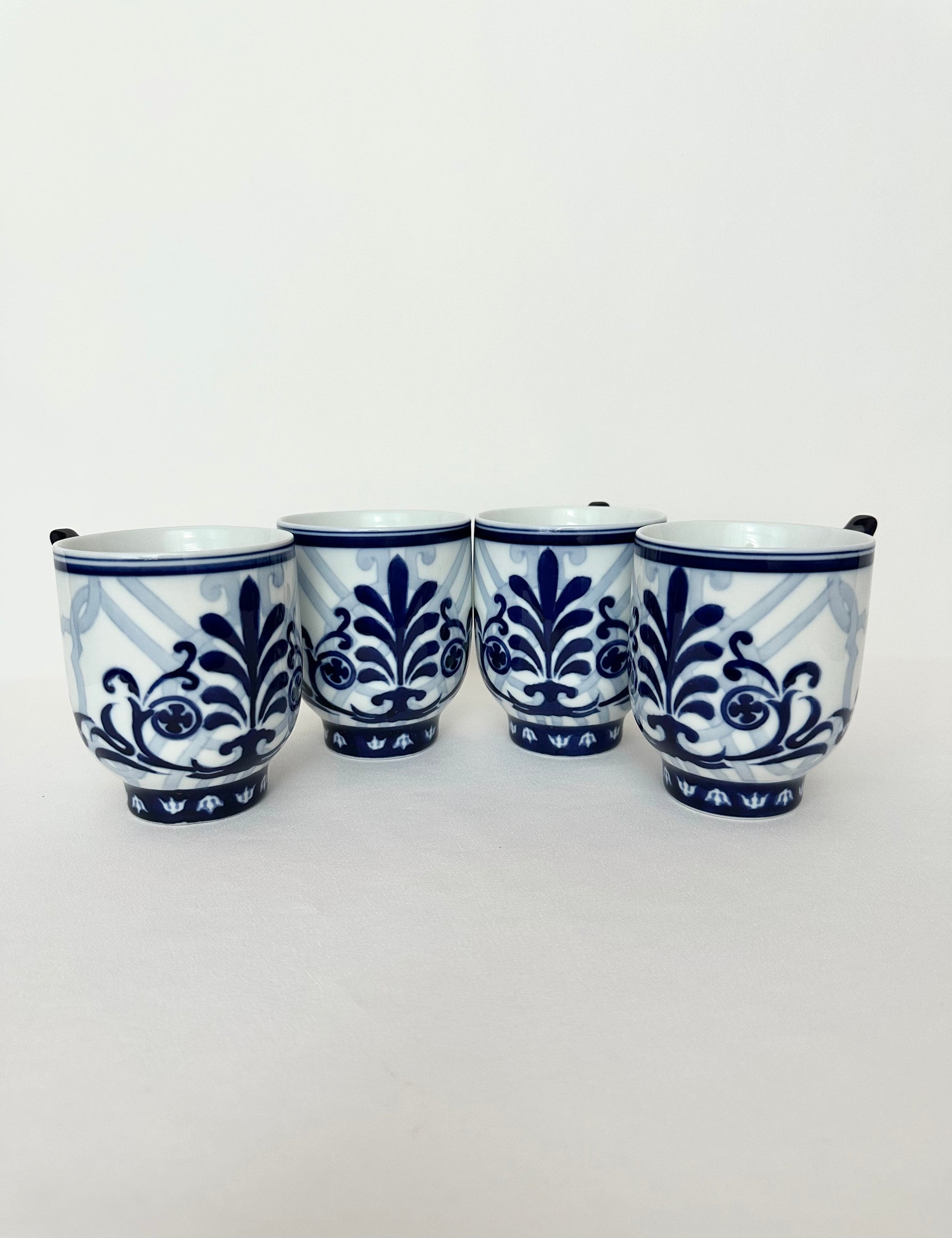 Vintage blue and white ceramic porcelain coffee cups set of four.