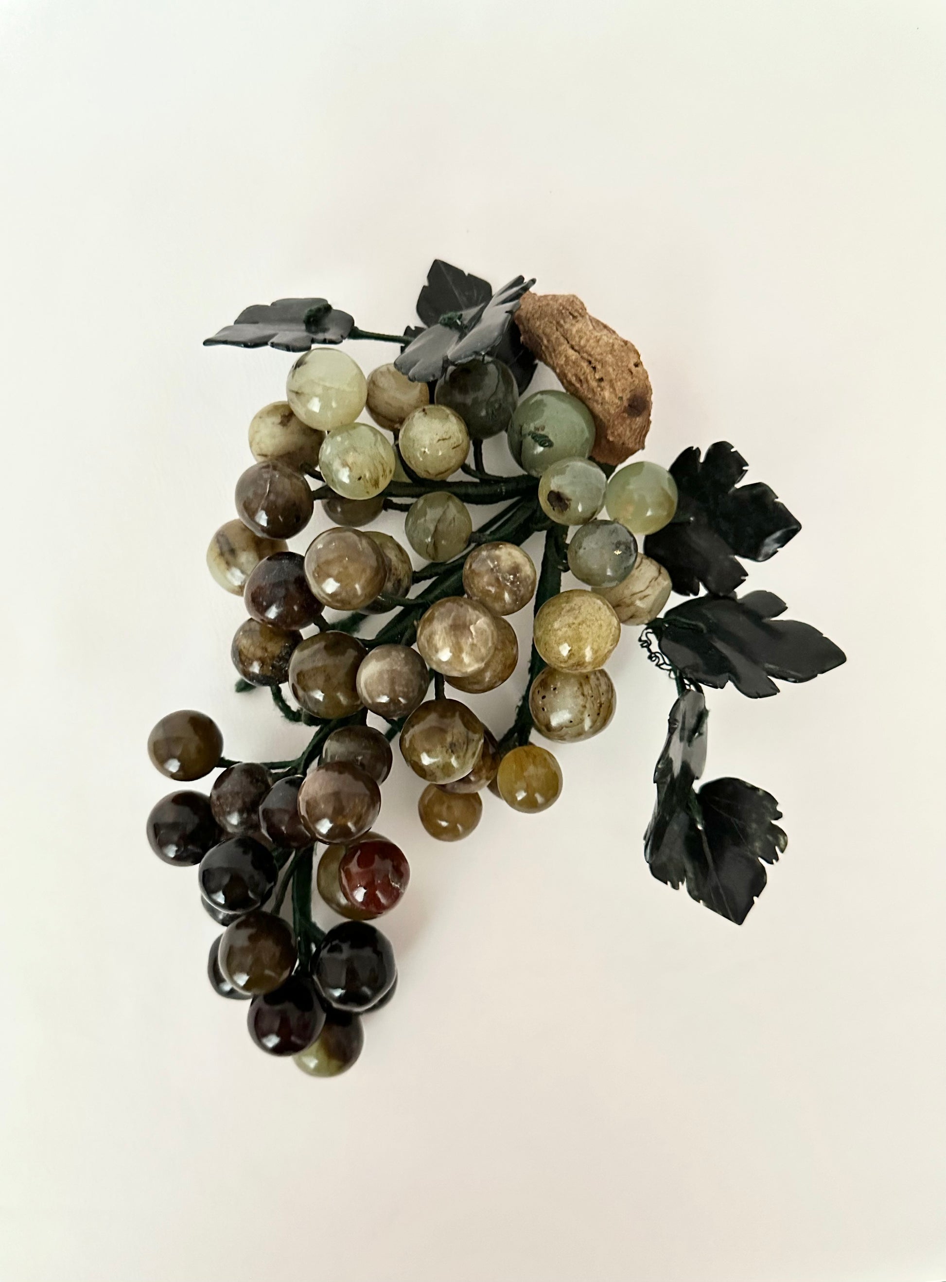 Vintage natural stone grapes cluster sculpture.