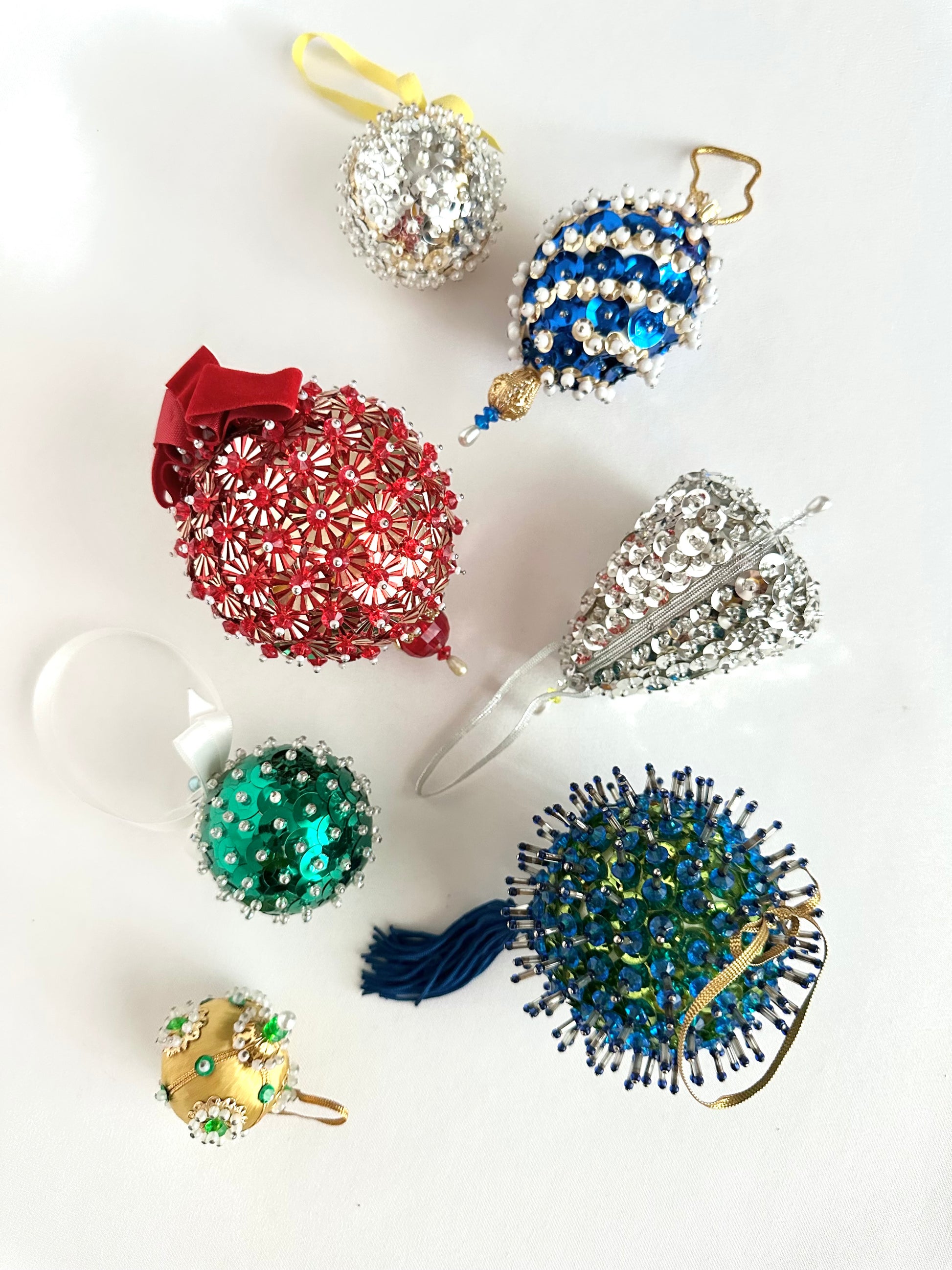 Vintage beaded push pin christmas tree ornaments set of seven in assorted shapes and colors.