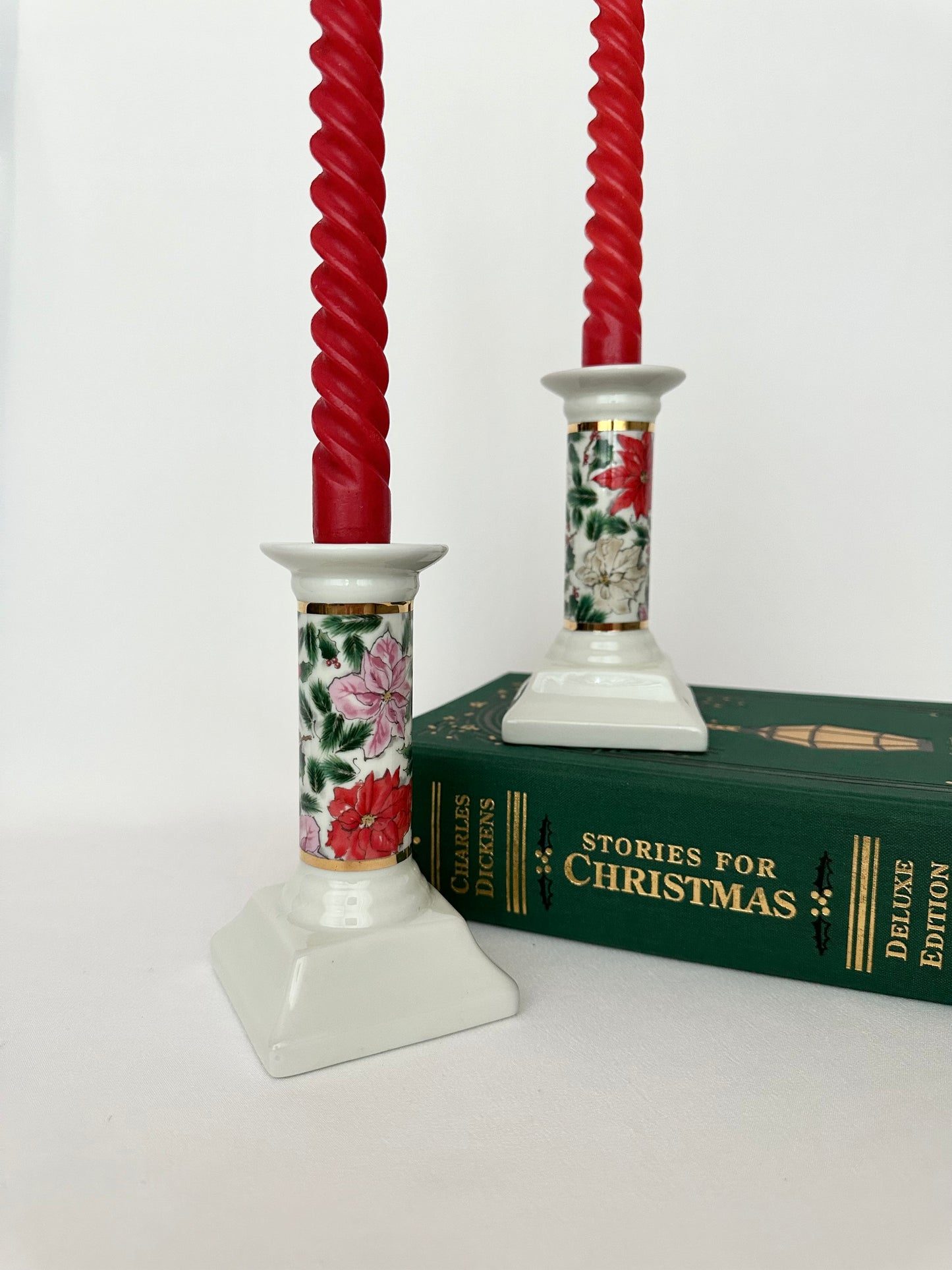 Vintage ceramic candlestick holder set of two with poinsettia flower pattern.