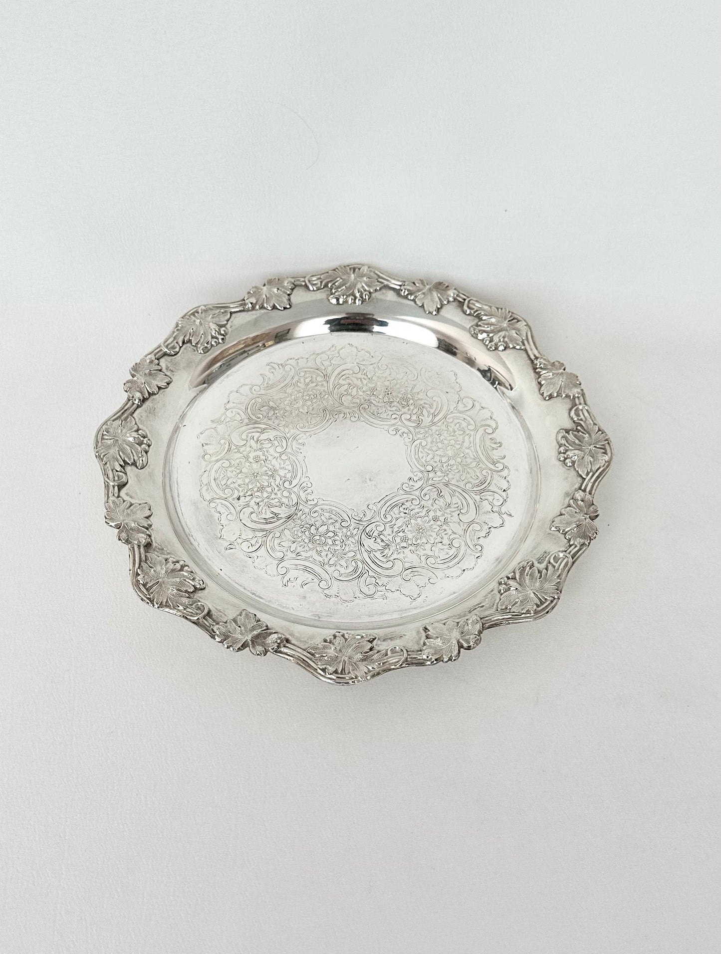 vintage small round etched silverplate tray with scalloped edge trimmed in grape leaves