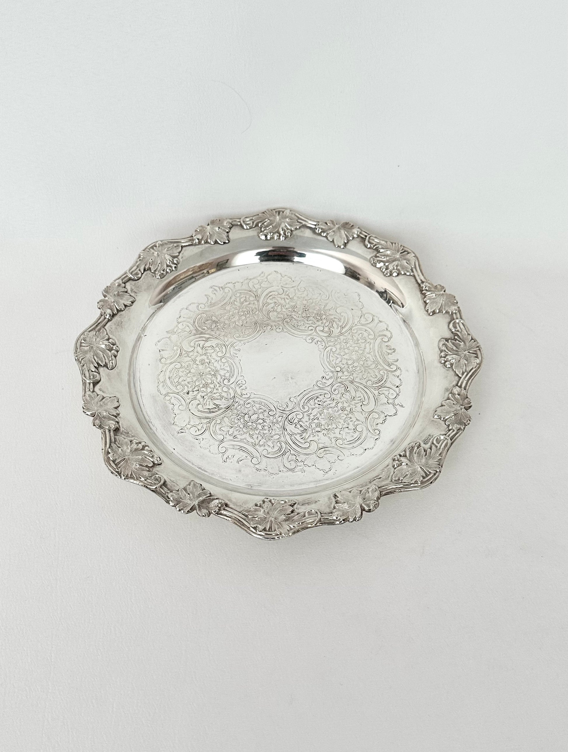 vintage small round etched silverplate tray with scalloped edge trimmed in grape leaves