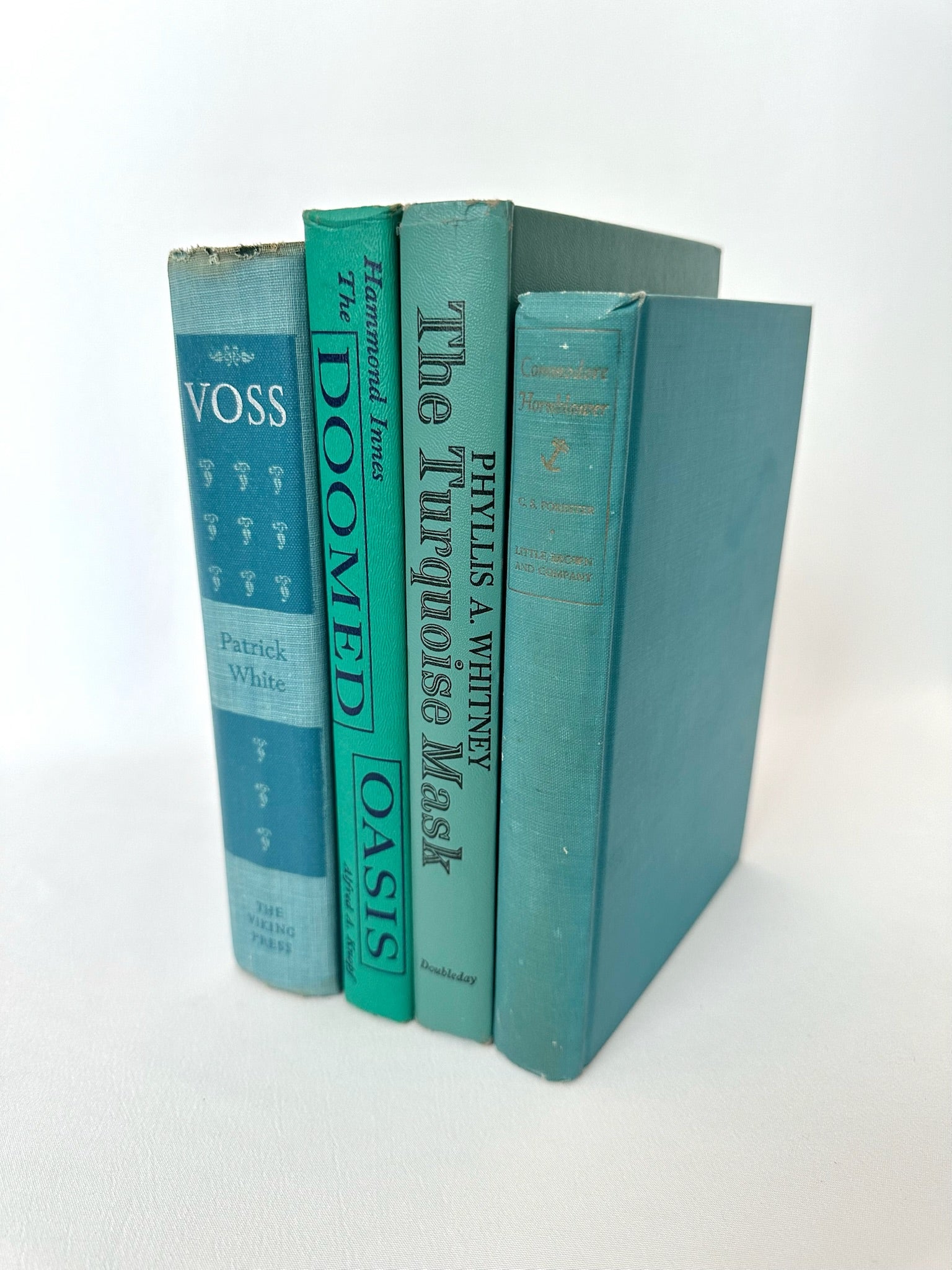 Vintage book stack set of four teal/green/blue covered novels