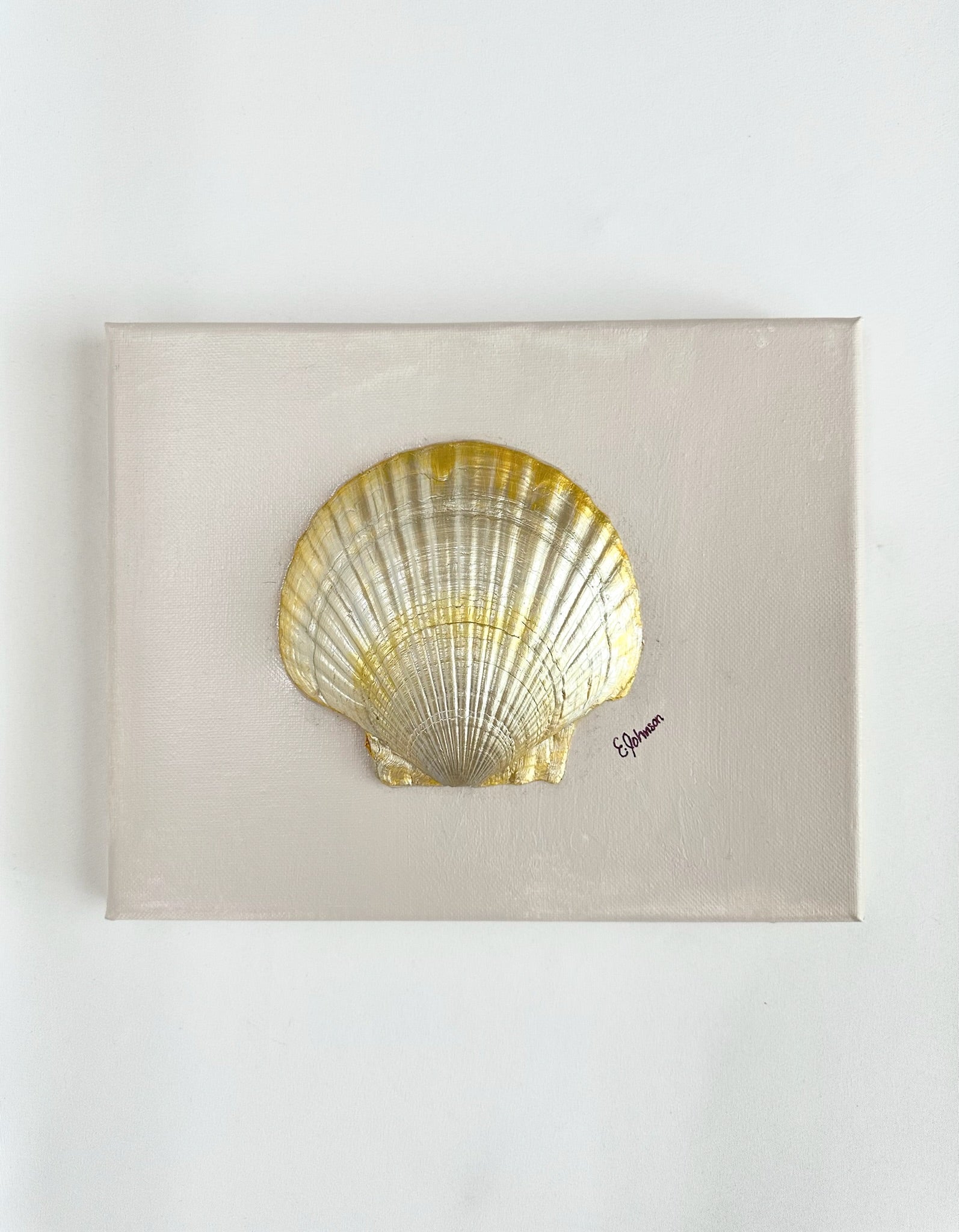painted canvas with mounted, gilded clamshell. artist signed