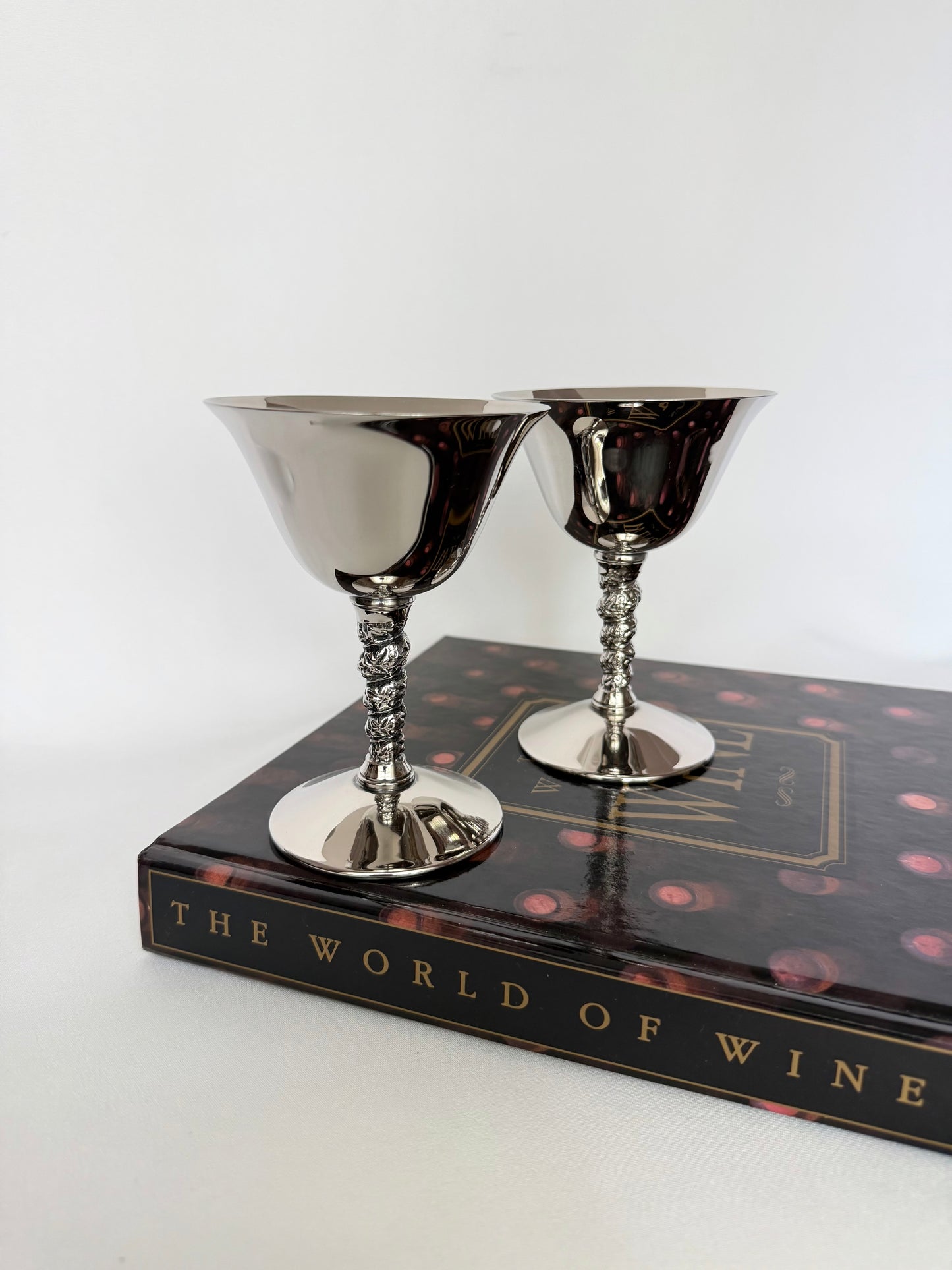 pair of vintage silverplate coupe or cocktail glasses with stem detail