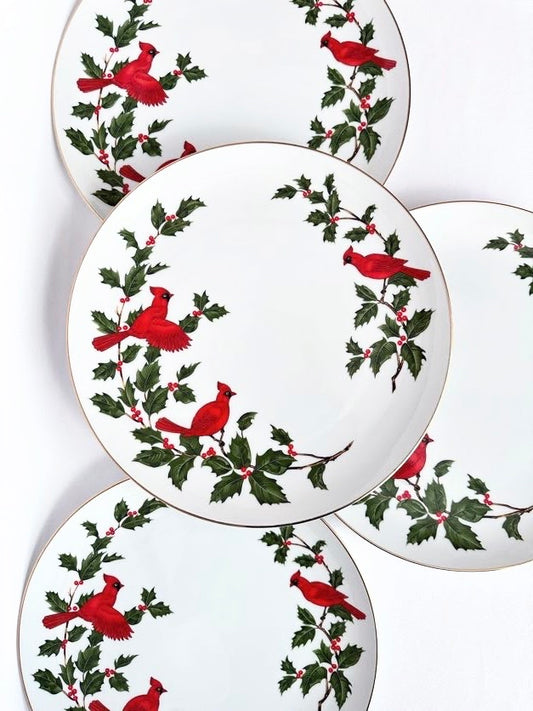 Vintage white china dinner plates set of four with red cardinals and green holly leaves.