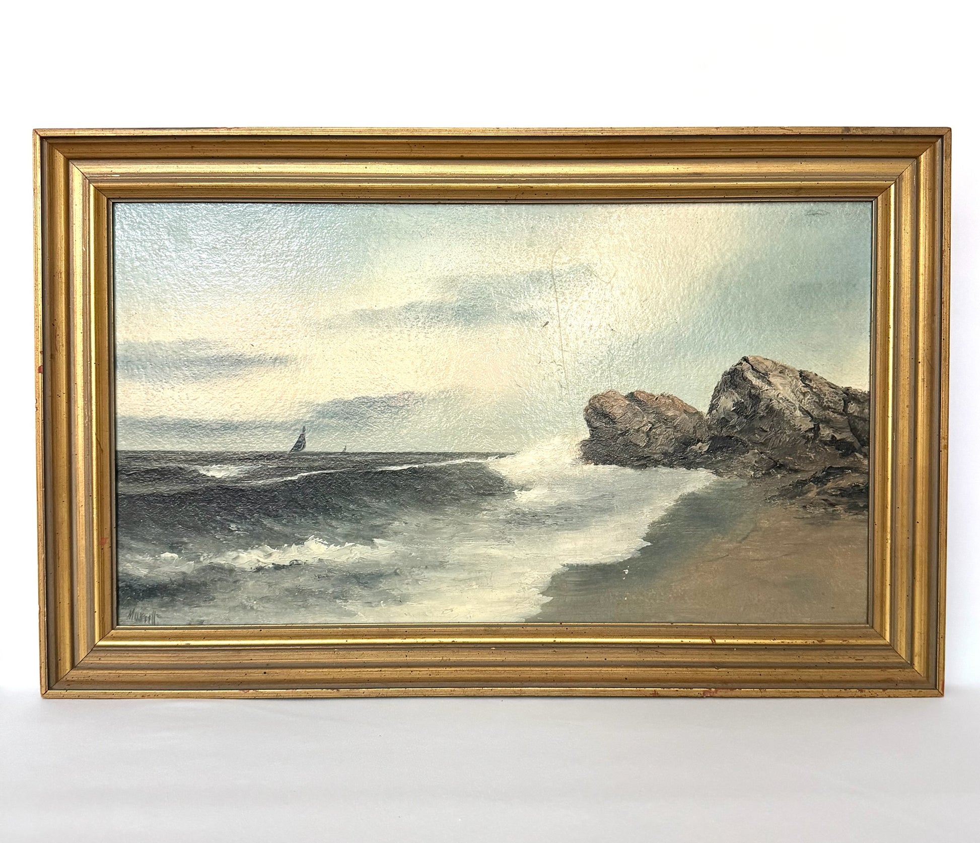 vintage framed oil seascape with boats and rocky shoreline