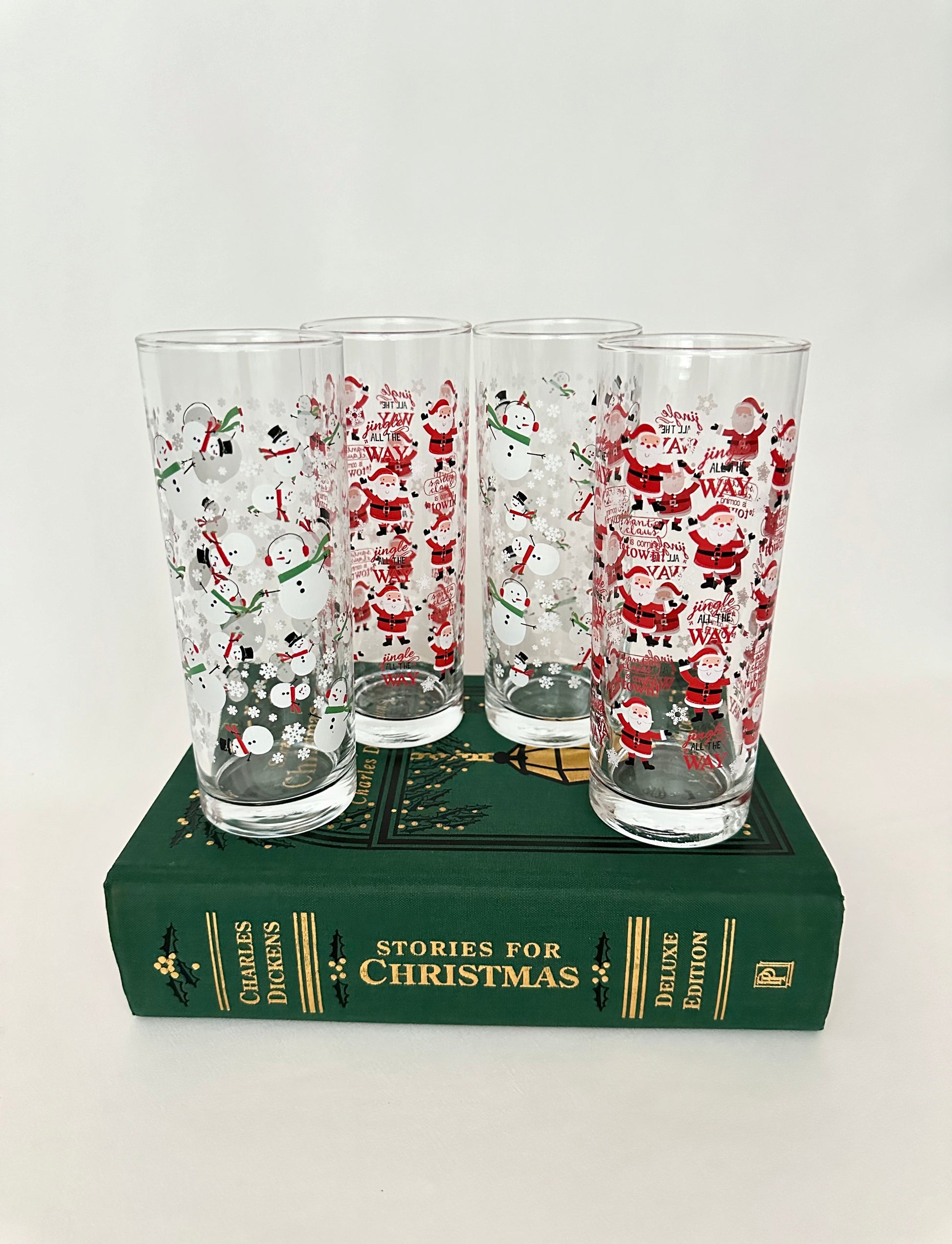 Vintage Santa Claus and Snowman patterned tumblers set of four. Two of each pattern.