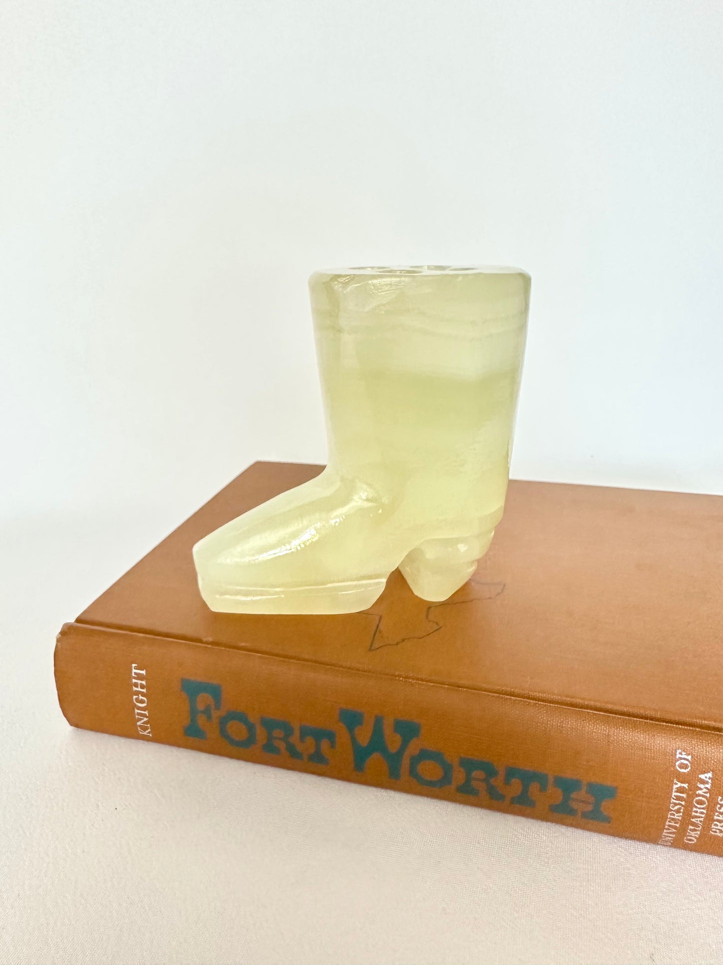 Vintage small alabaster cowboy boot figurine with four holes on top for pencils or tools