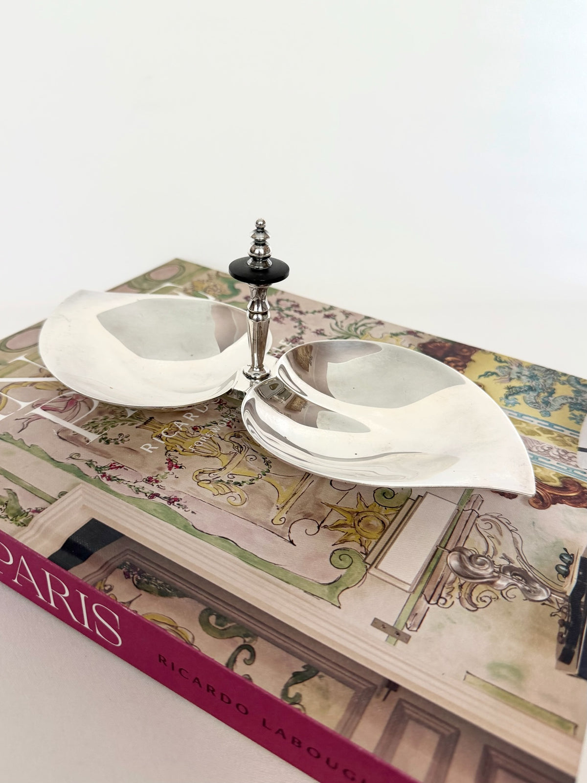 Vintage silverplate dual leaf shaped serving dish with center handle.