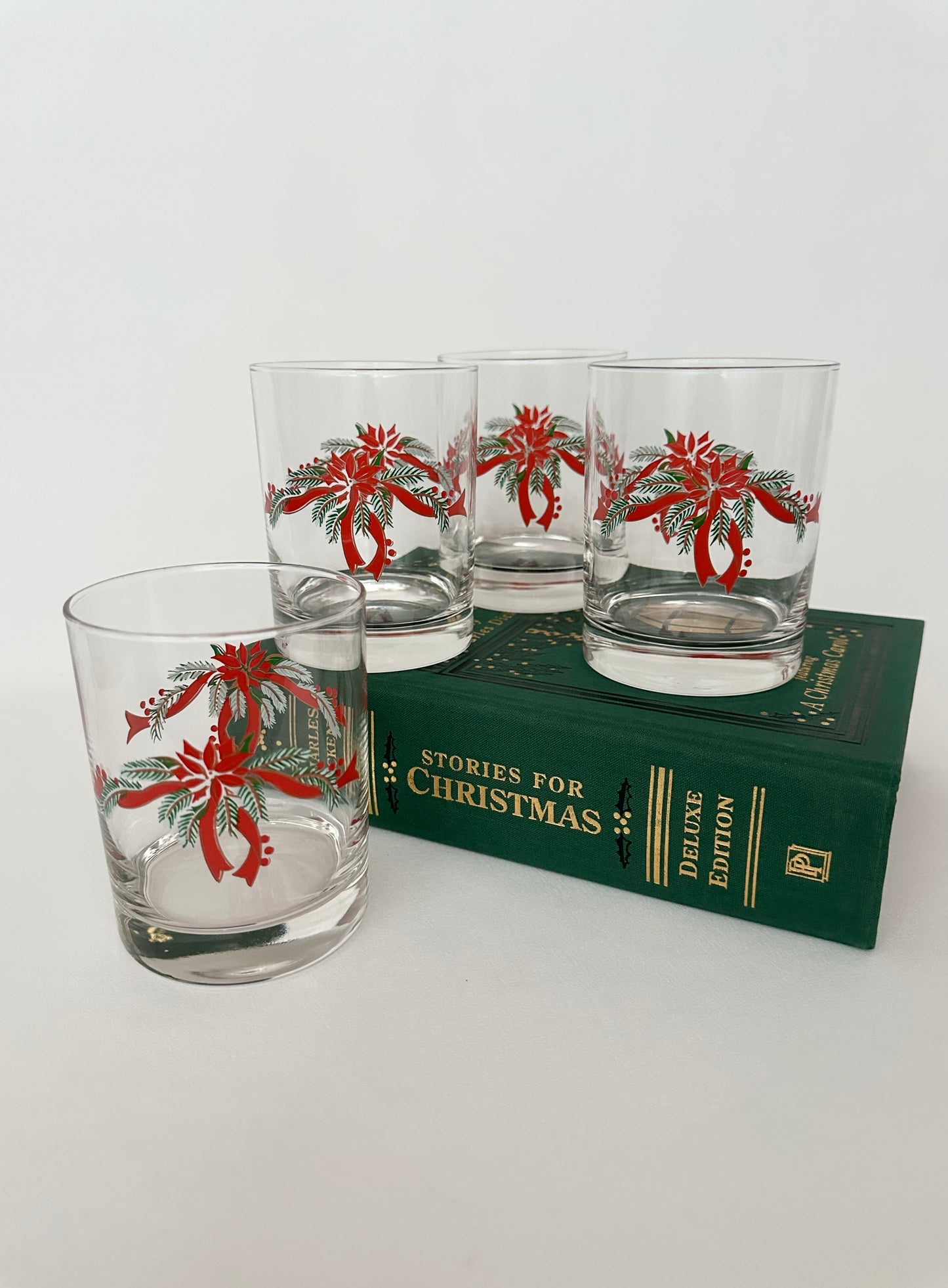 Vintage poinsettia and ribbon decorated double old fashioneds set of four.