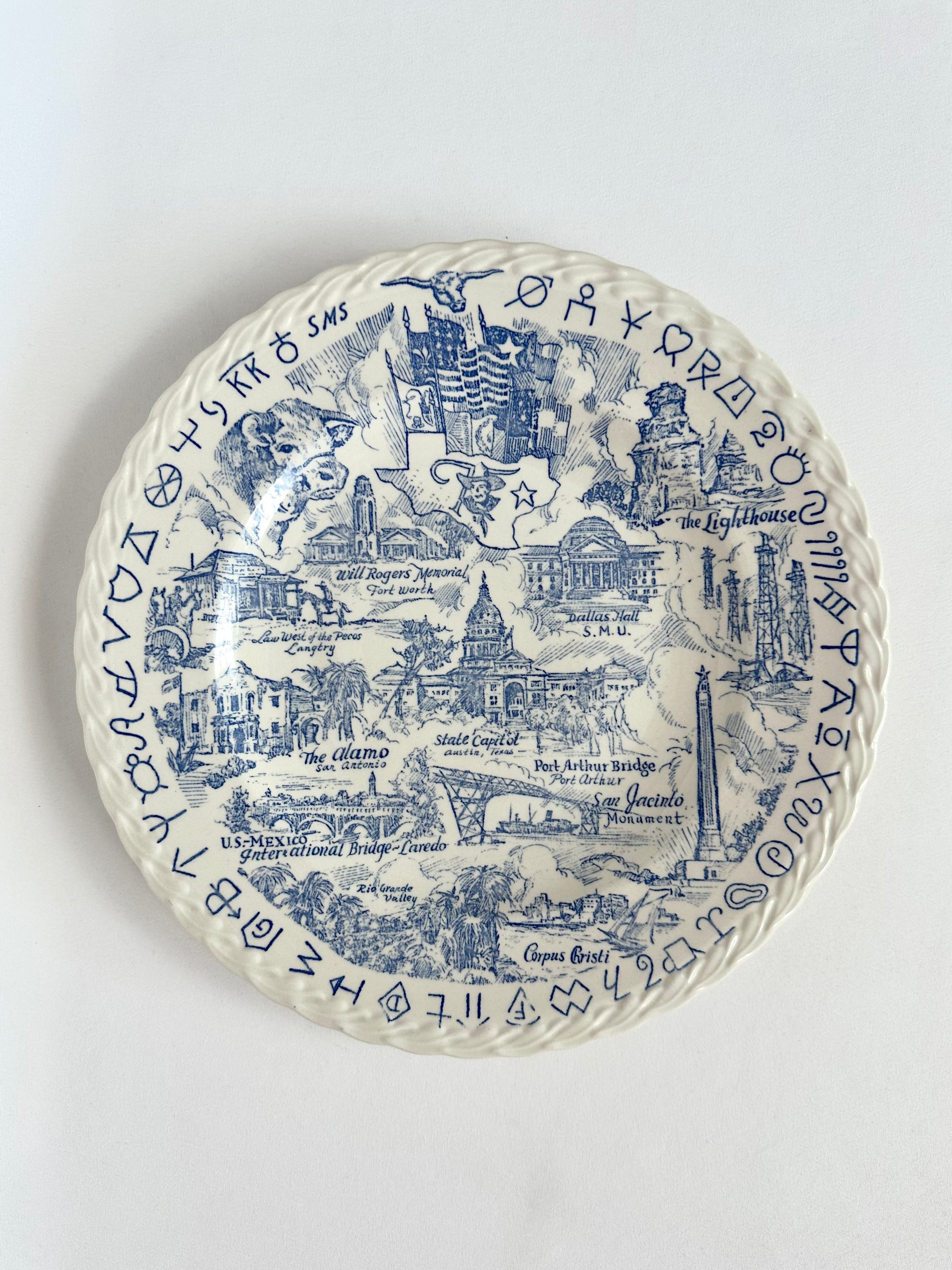Vintage Texas souvenir plate featuring iconic images in a blue transferware pattern