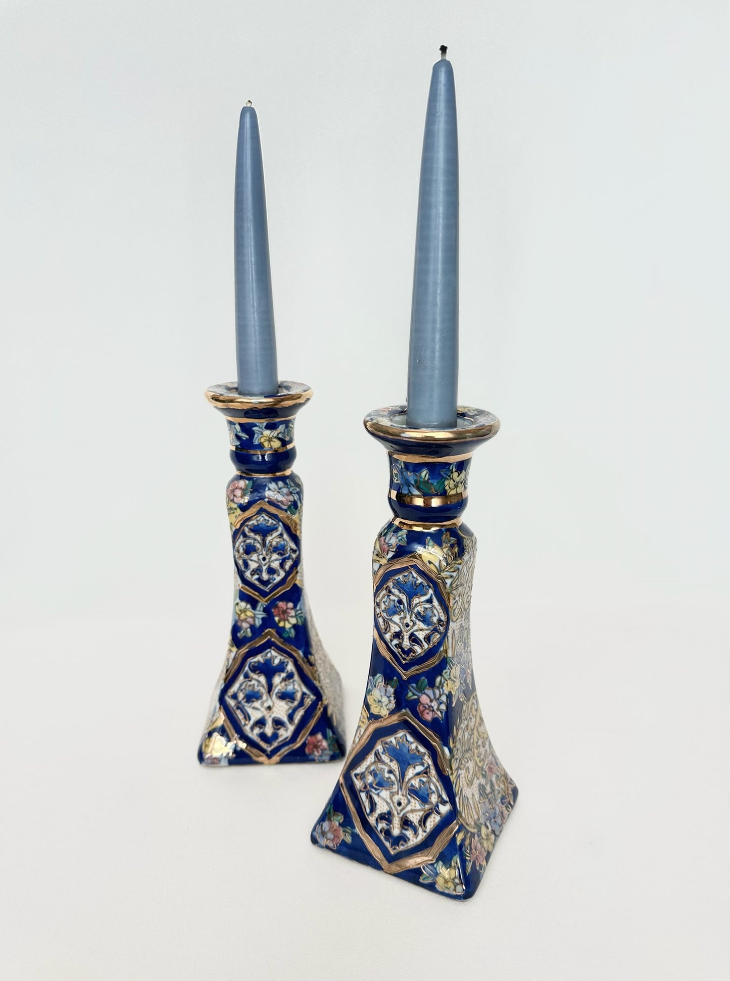 vintage chinoiserie porcelain candlesticks set of two with blue background, flowers and gilt trim