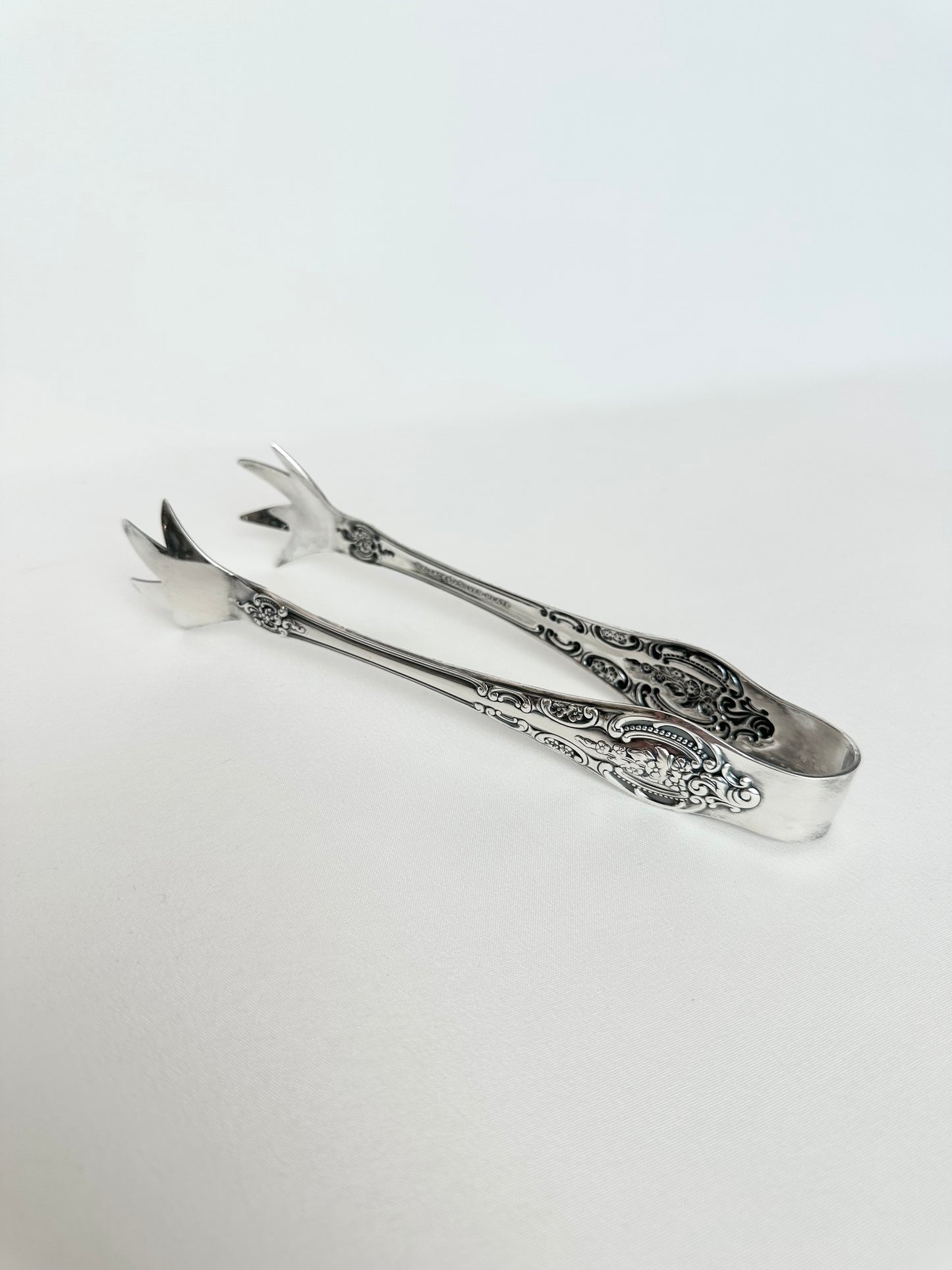 Vintage ornate silverplate ice tongs