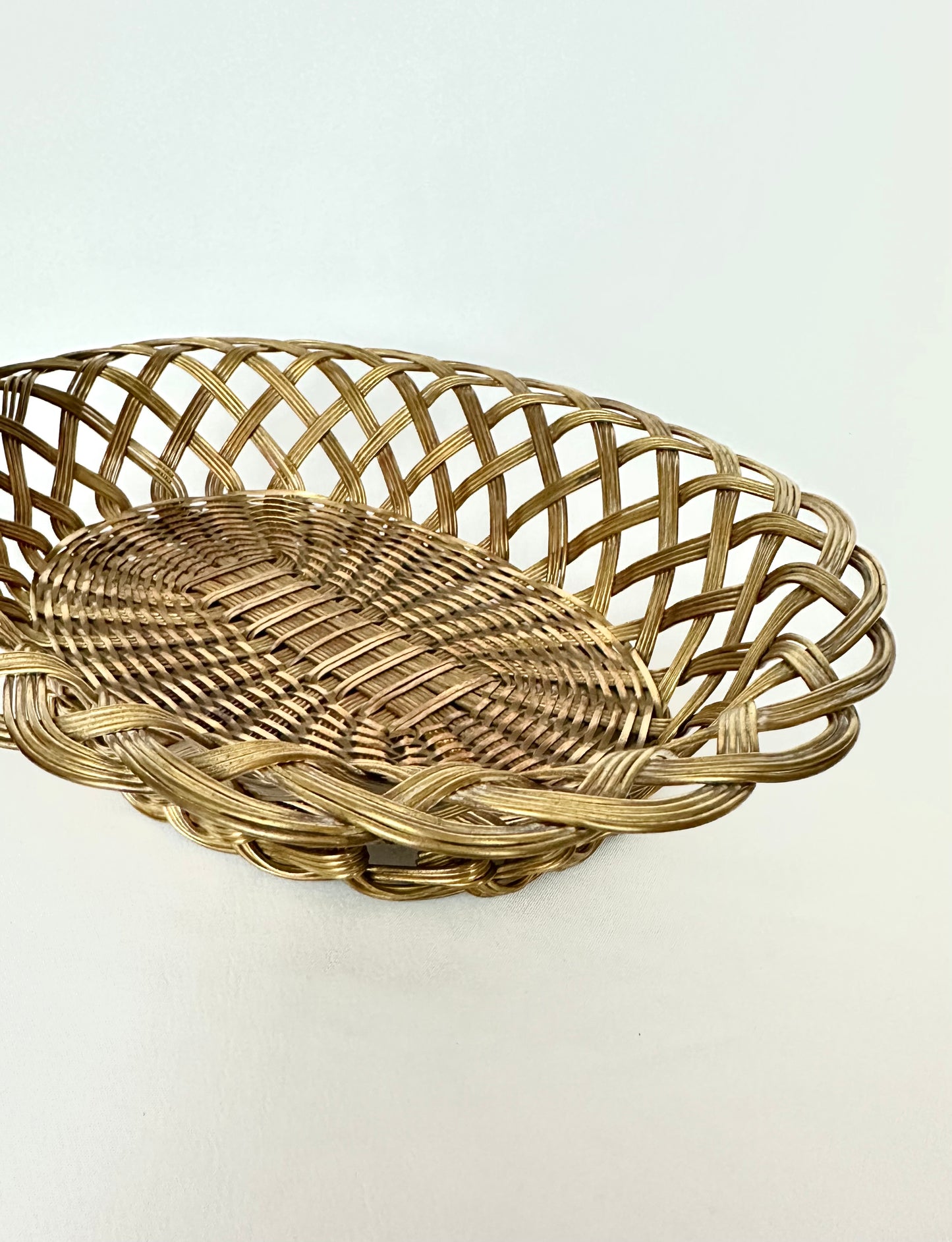 Vintage brass wire woven lattice edged basket.