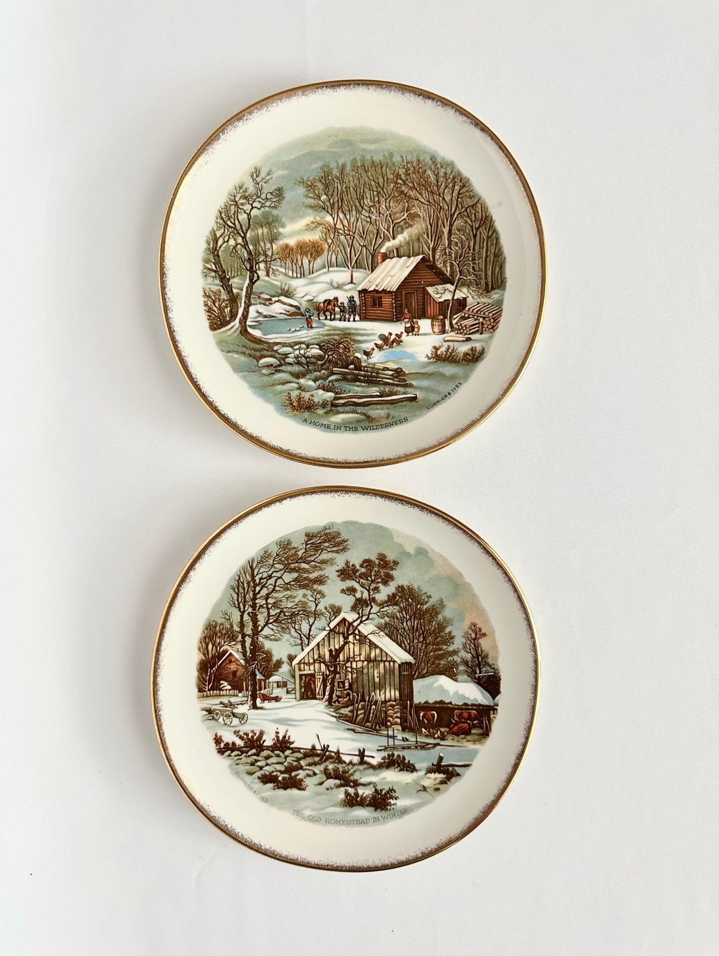 Vintage winter scene decorative plates set of two by Currier & Ives.