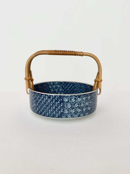 vintage blue and white chinoiserie bowl with rattan handle by Fitz and Floyd