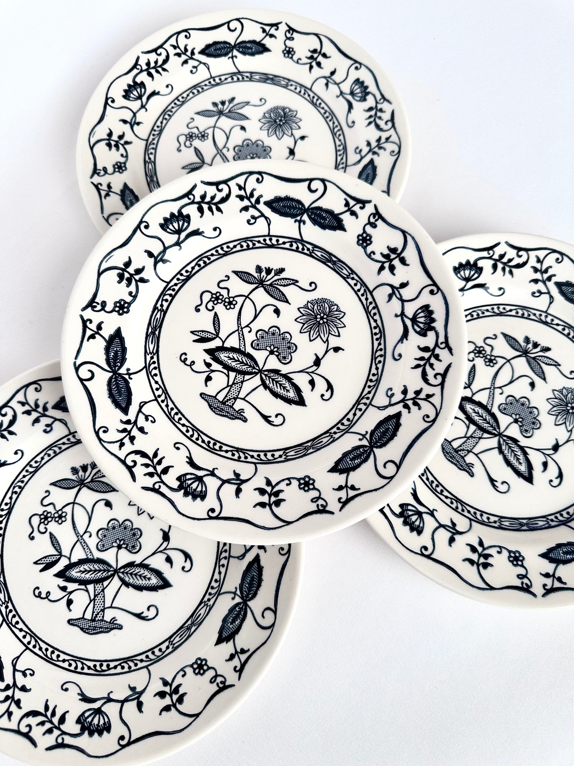 Vintage blue and white patterned small ceramic snack plates set of four.