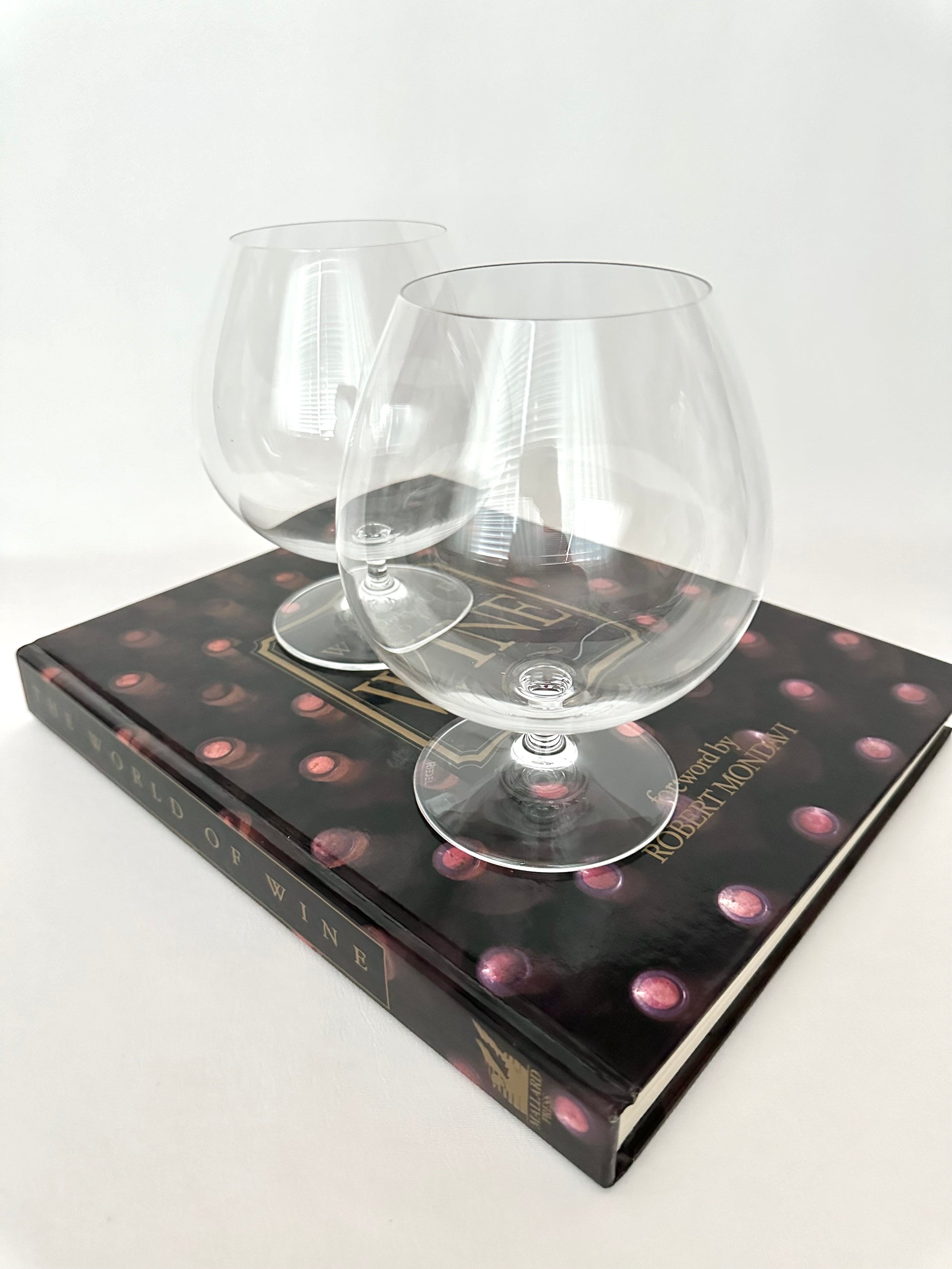 Set of two classic crystal Riedel brandy snifters.