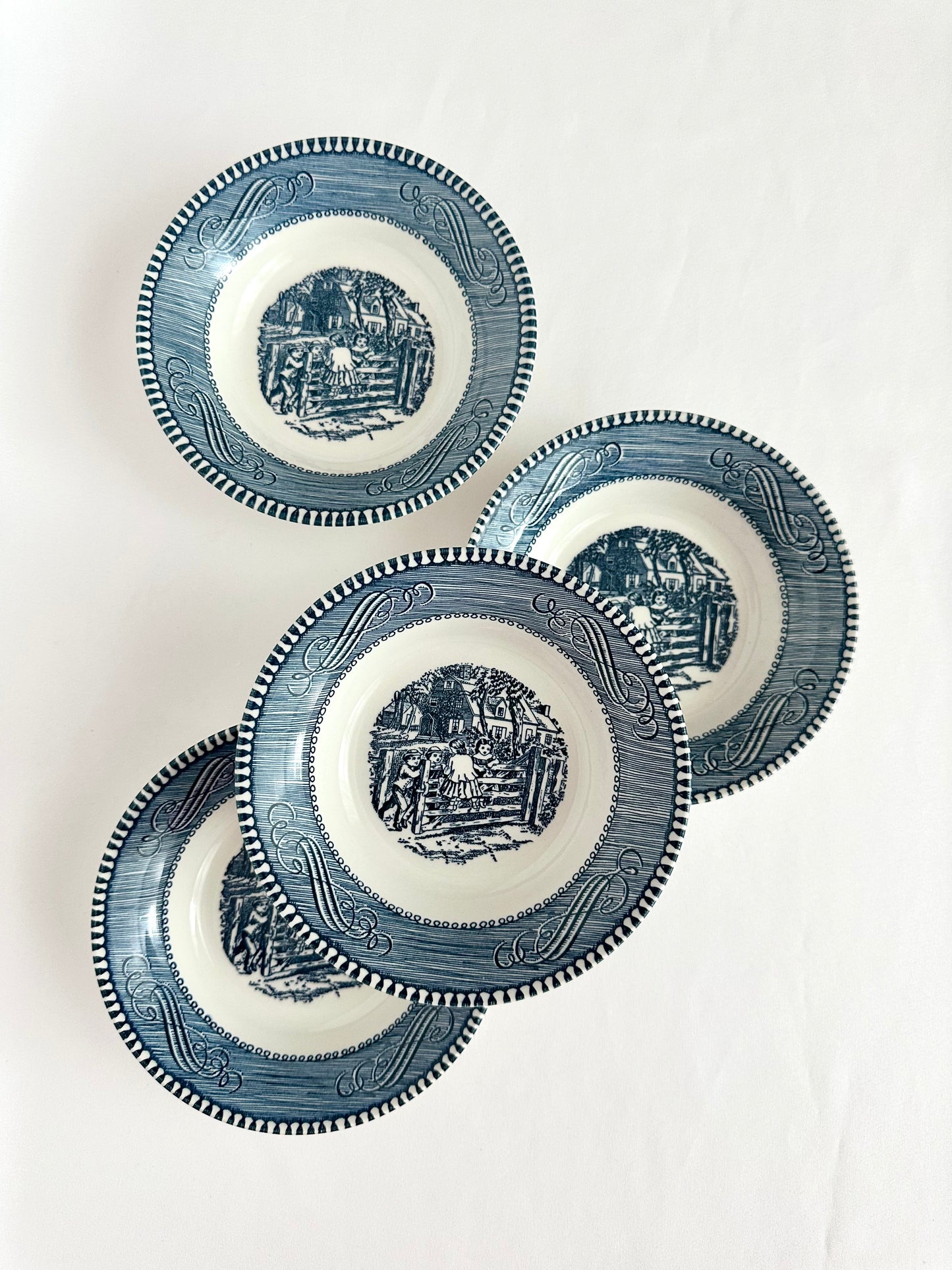 Set of four blue and white transferware berry bowls by Currier & Ives.