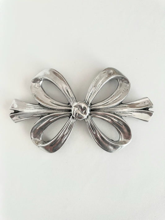 vintage silver pewter bow shaped trivet with rubber feet