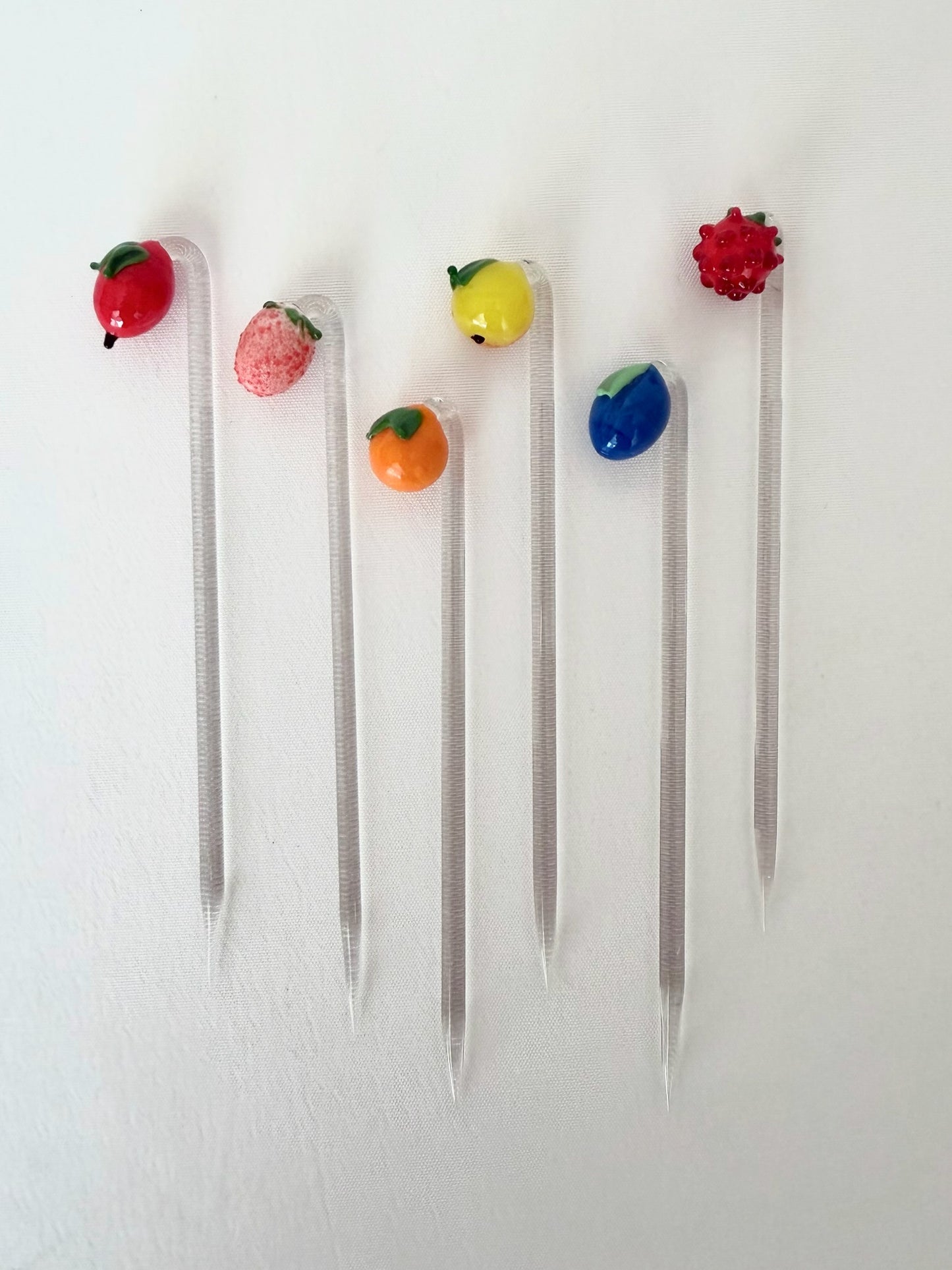 set of six glass cocktail picks with assorted fruit detail