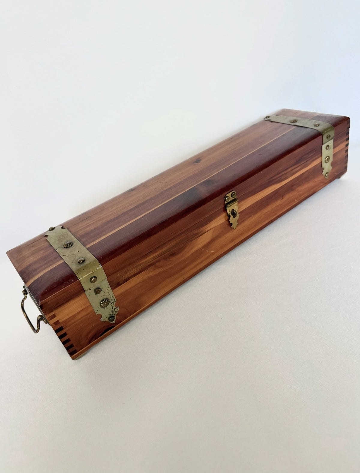 vintage mini cedar trunk decorative box with brass fittings in an elongated shape