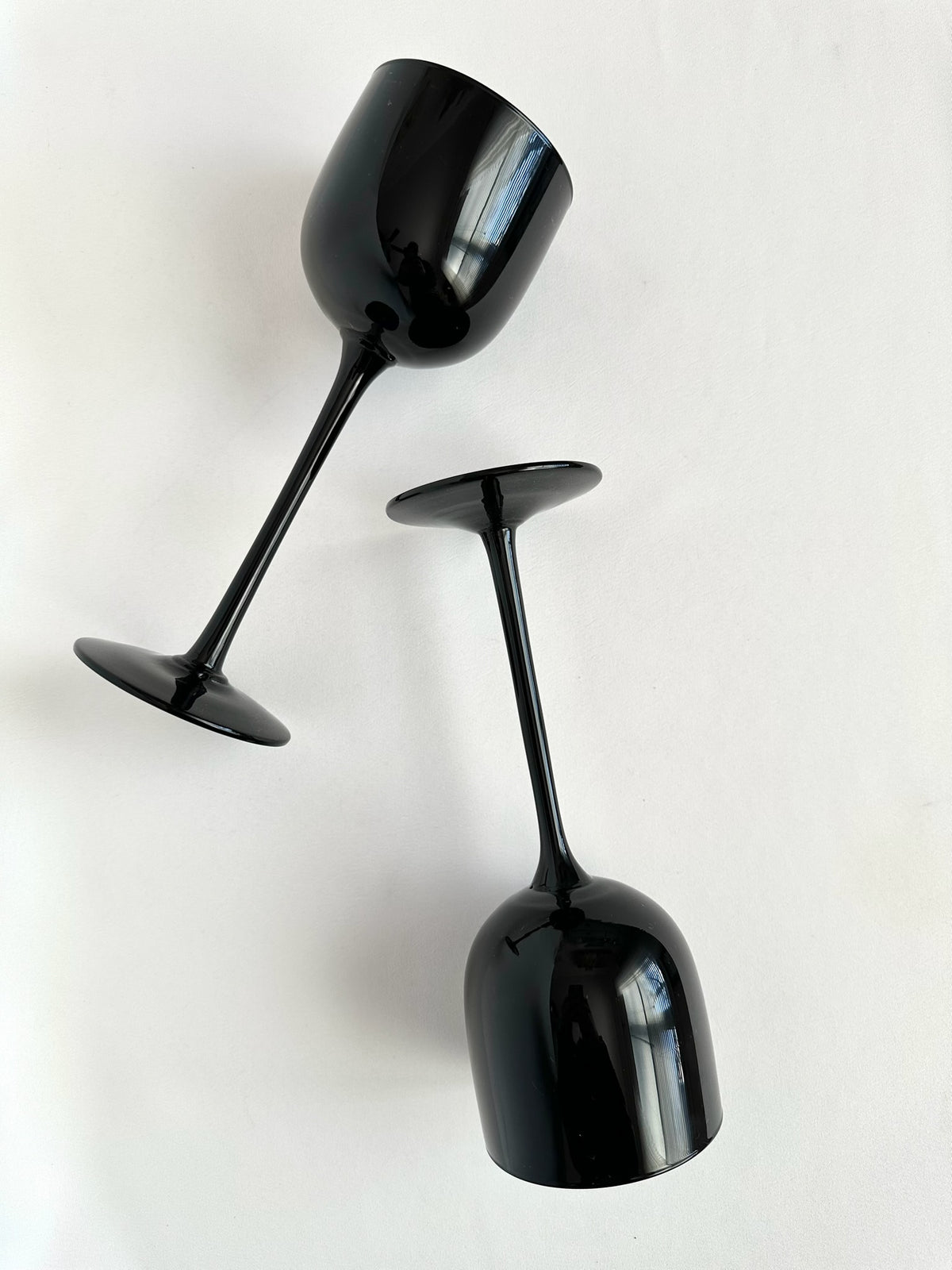 Vintage pair of black Italian glass tall slender wine goblets.