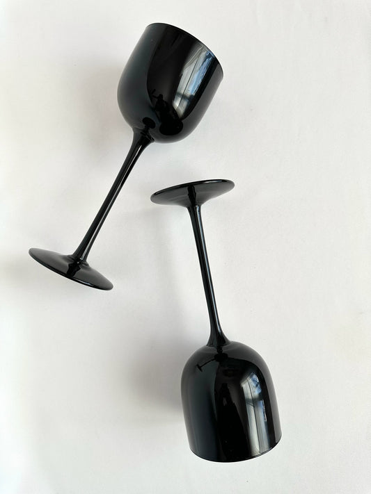 Vintage pair of black Italian glass tall slender wine goblets.