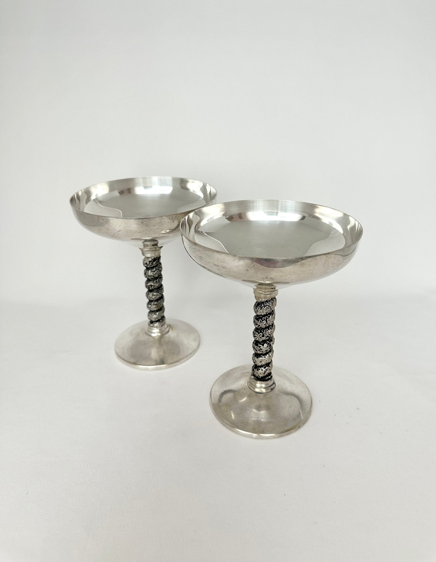 Vintage silverplate coupes set of two with ornate stems.