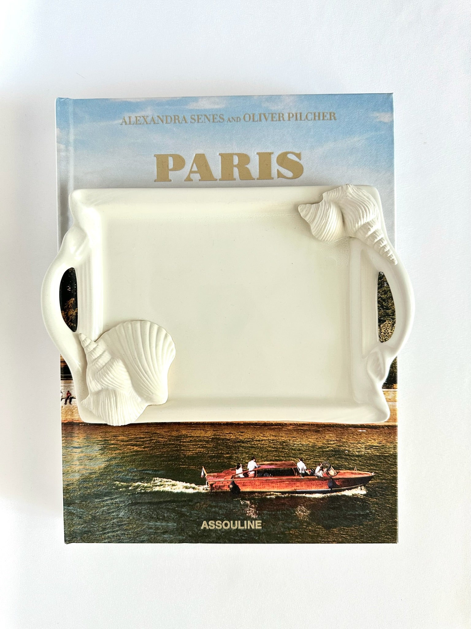 small vintage ceramic tray with seashell relief design and handles in off white