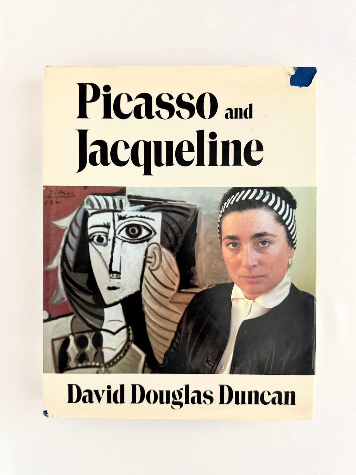 A vintage hardcover book titled 'Picasso and Jacqueline' by David Douglas Duncan, featuring a cream-colored cover with black text and a central artwork depicting Pablo Picasso and Jacqueline Roque in a cubist style.