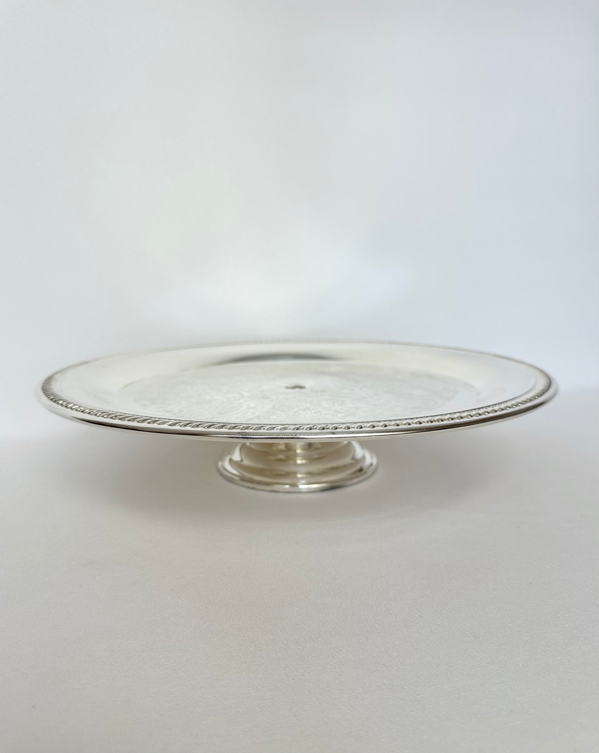 Vintage silverplate footed cake stand or platter.