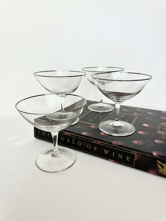 Vintage platinum rimmed crystal coupes set of four.