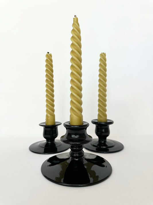 Vintage black glass mismatched candlestick holders set of three.