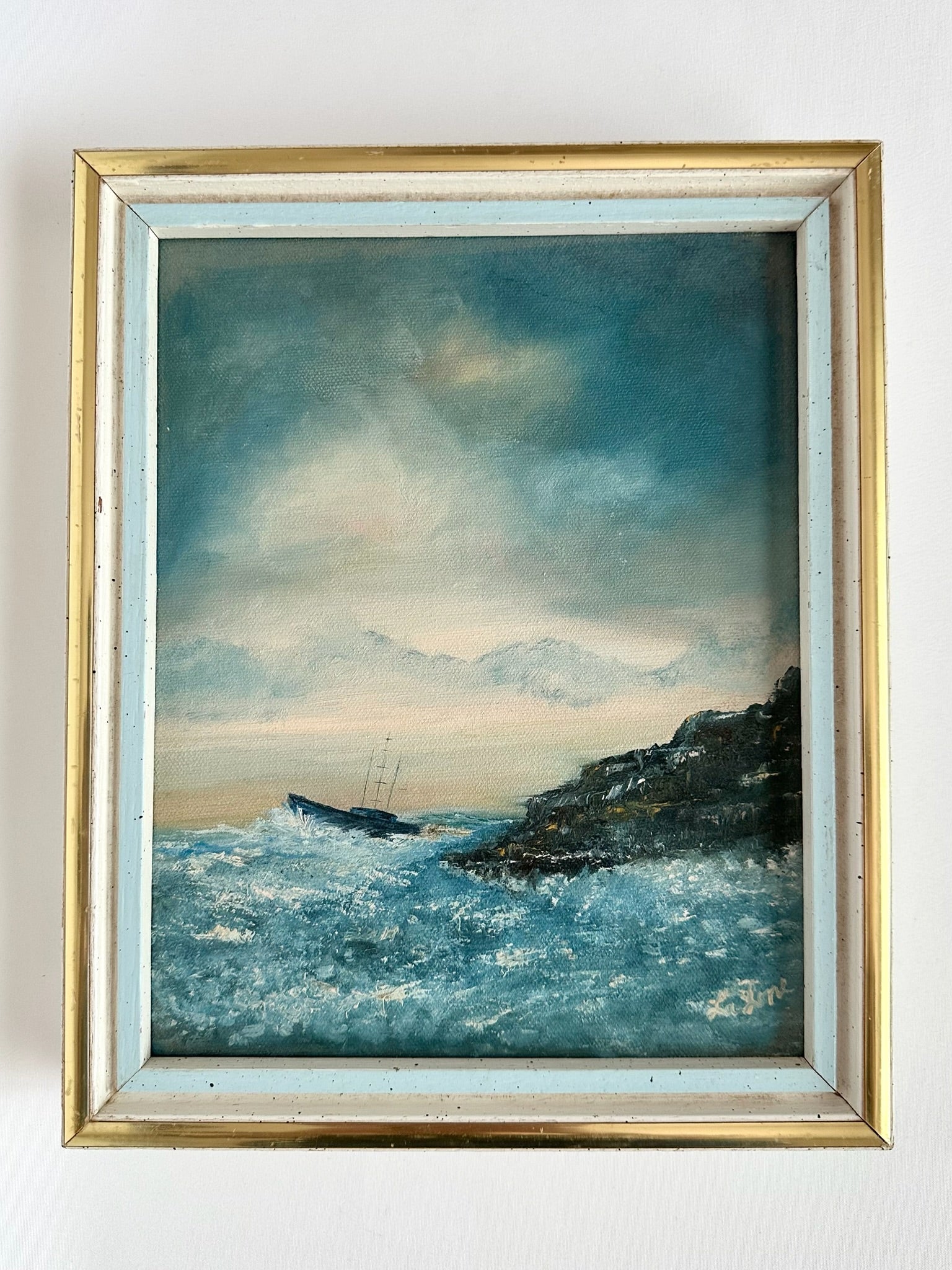 vintage original acrylic framed seascape with boat and rocky shoreline