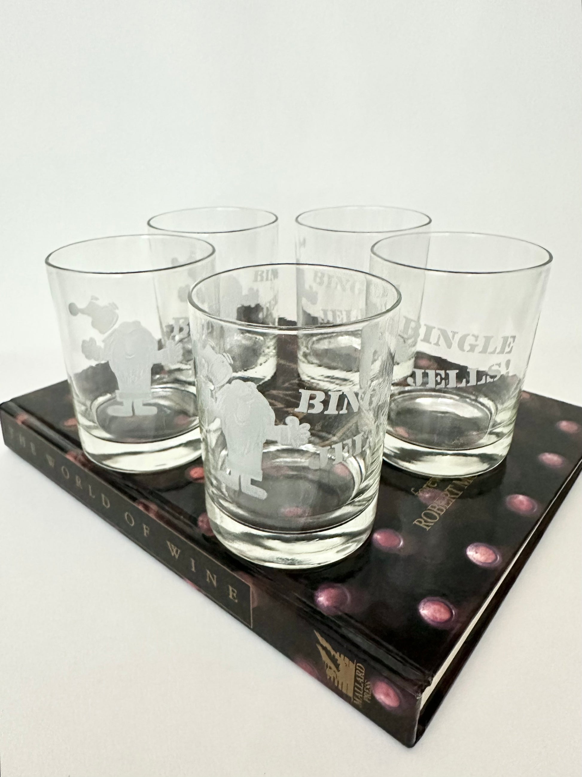 Set of five Drunken Santa double old fashioneds by Neiman Marcus.