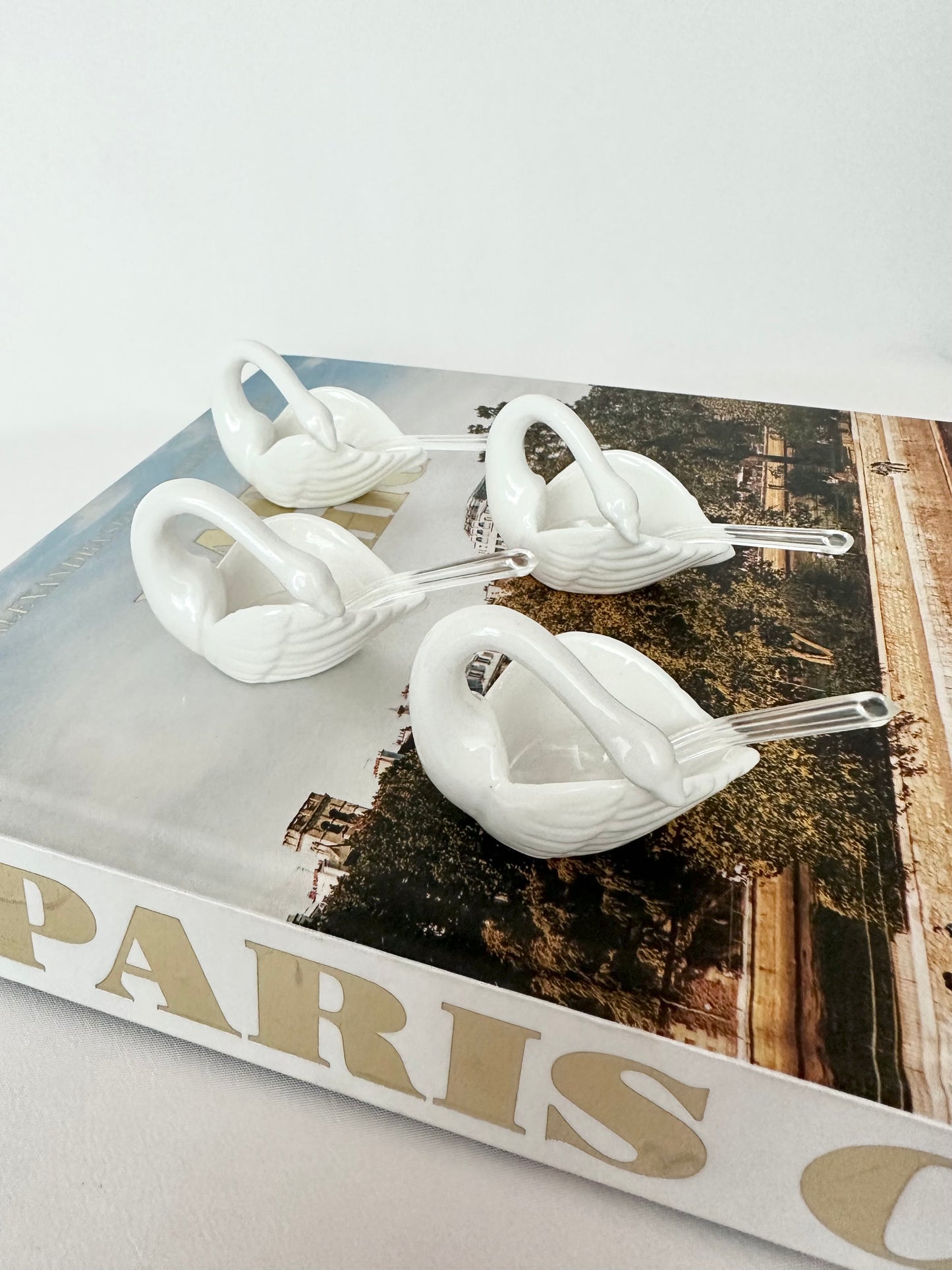 Vintage porcelain swan shaped salt cellars with tiny spoons set of four.