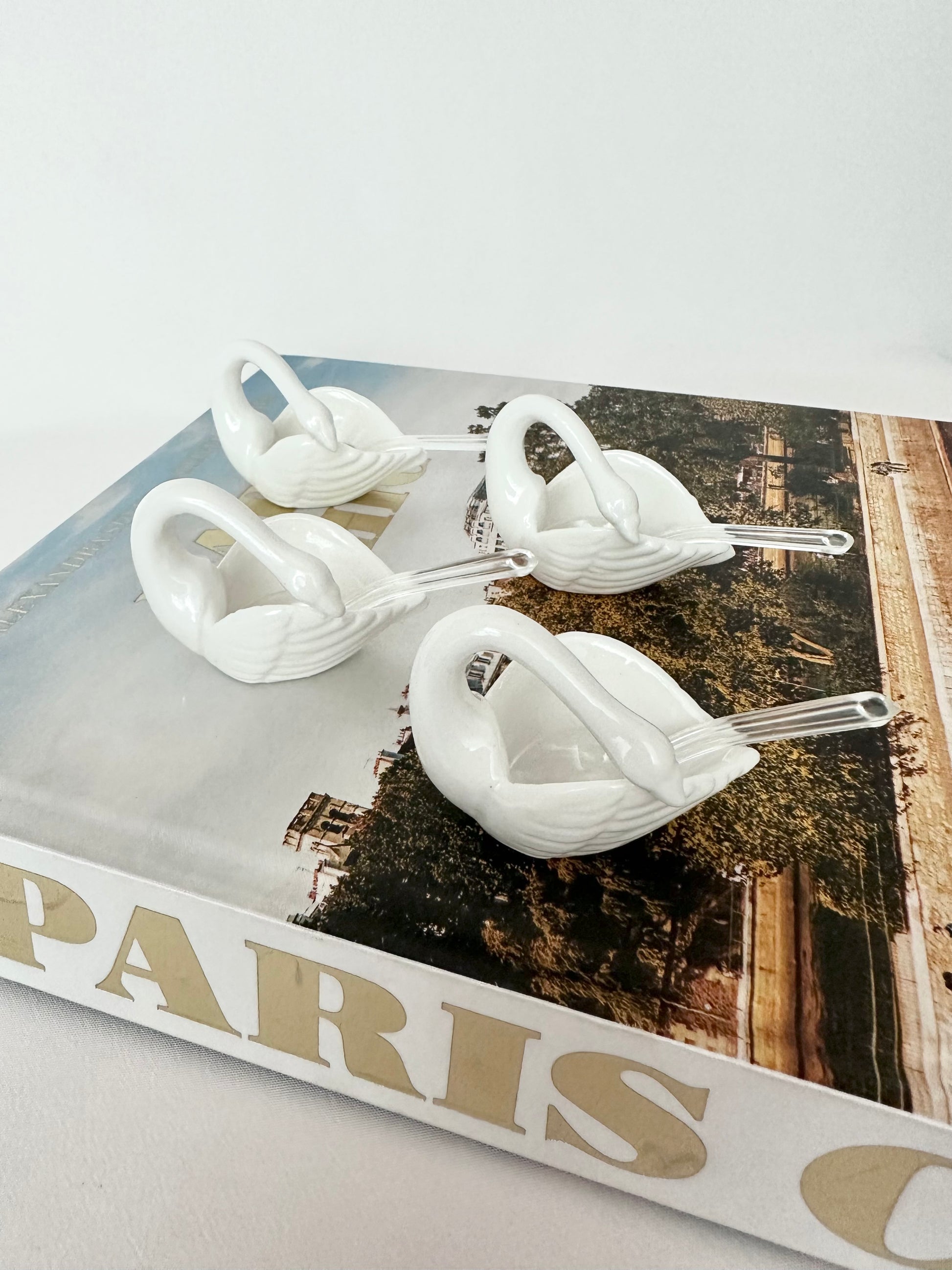 Vintage porcelain swan shaped salt cellars with tiny spoons set of four.