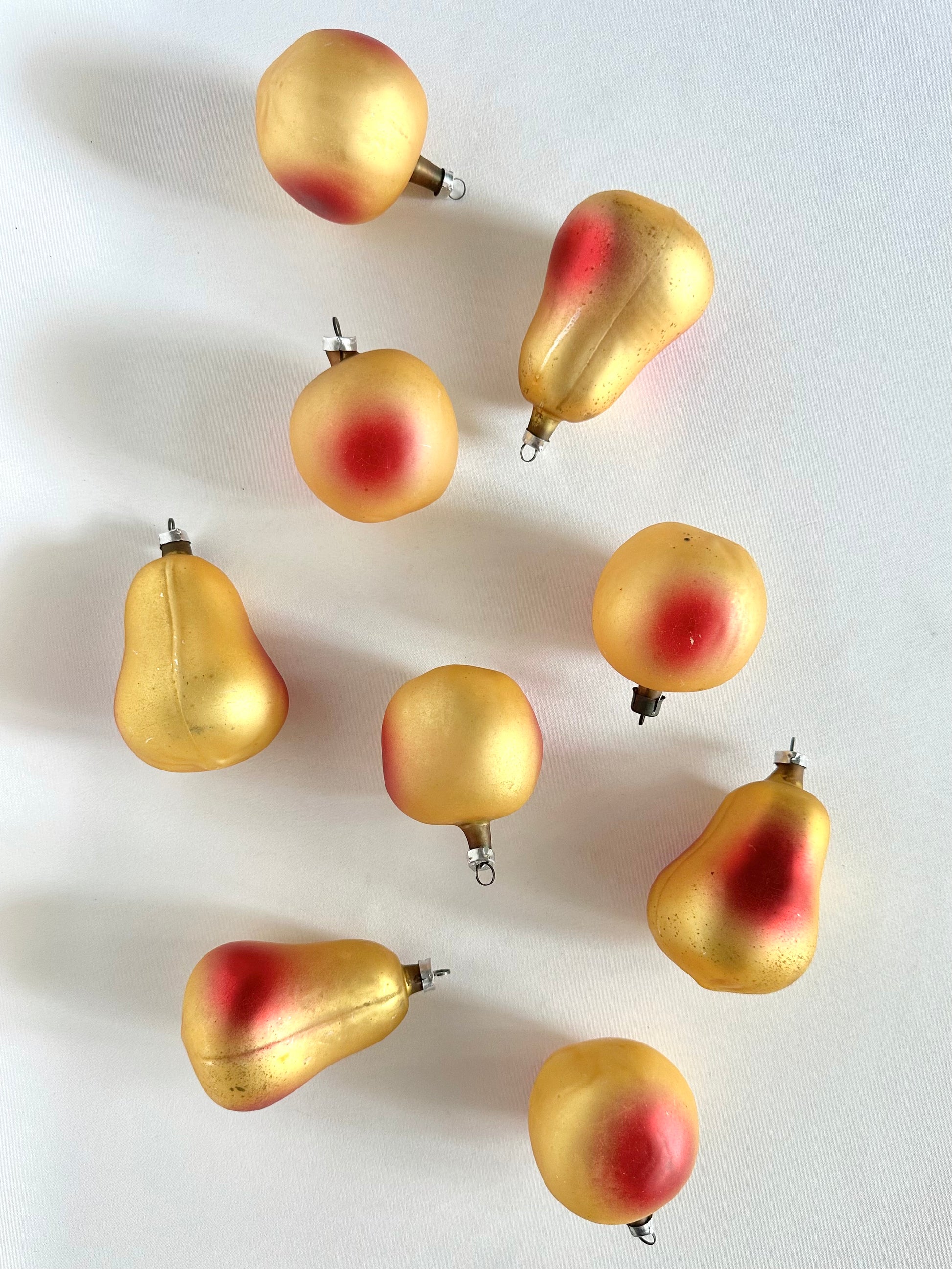 Vintage handblown glass pear and apple christmas tree ornaments set of nine in yellow and red.